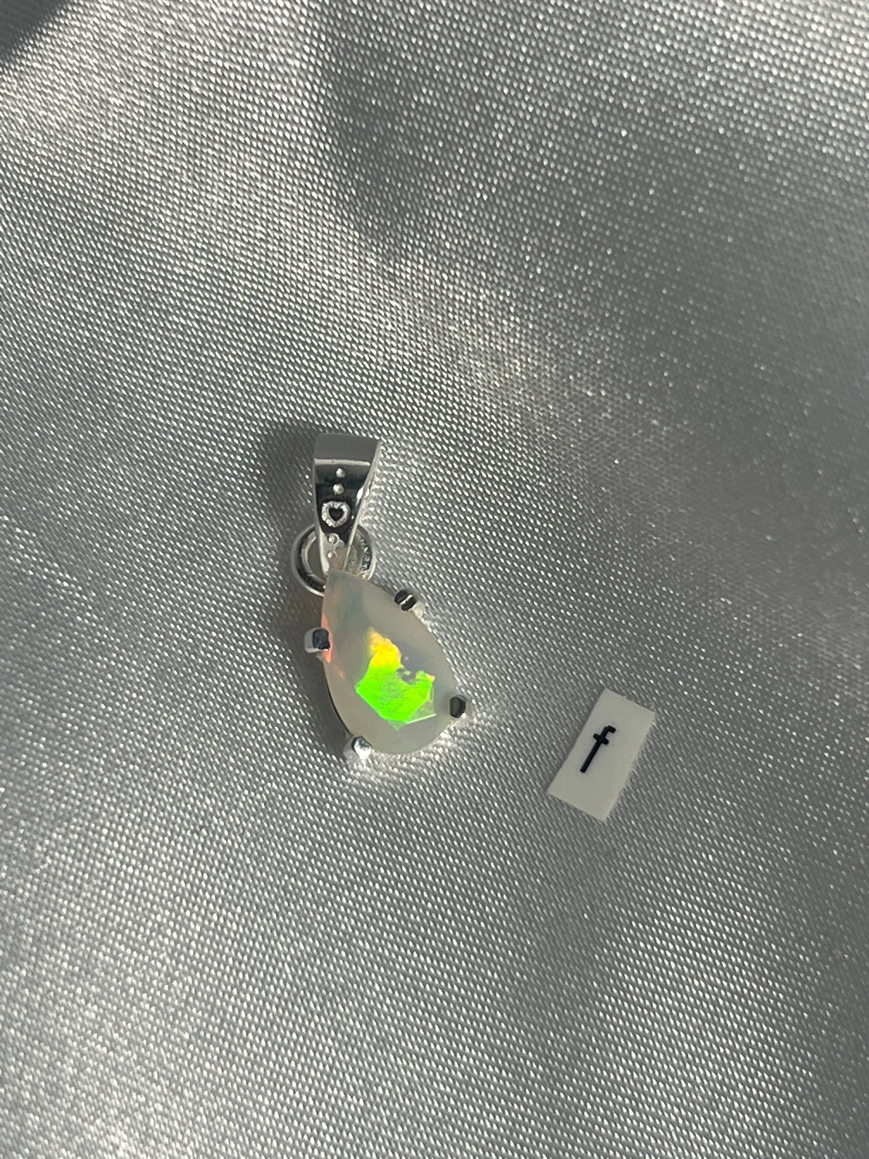 Dainty Prong Set Facet Cut Teardrop Shaped Ethiopian Opal Pendant