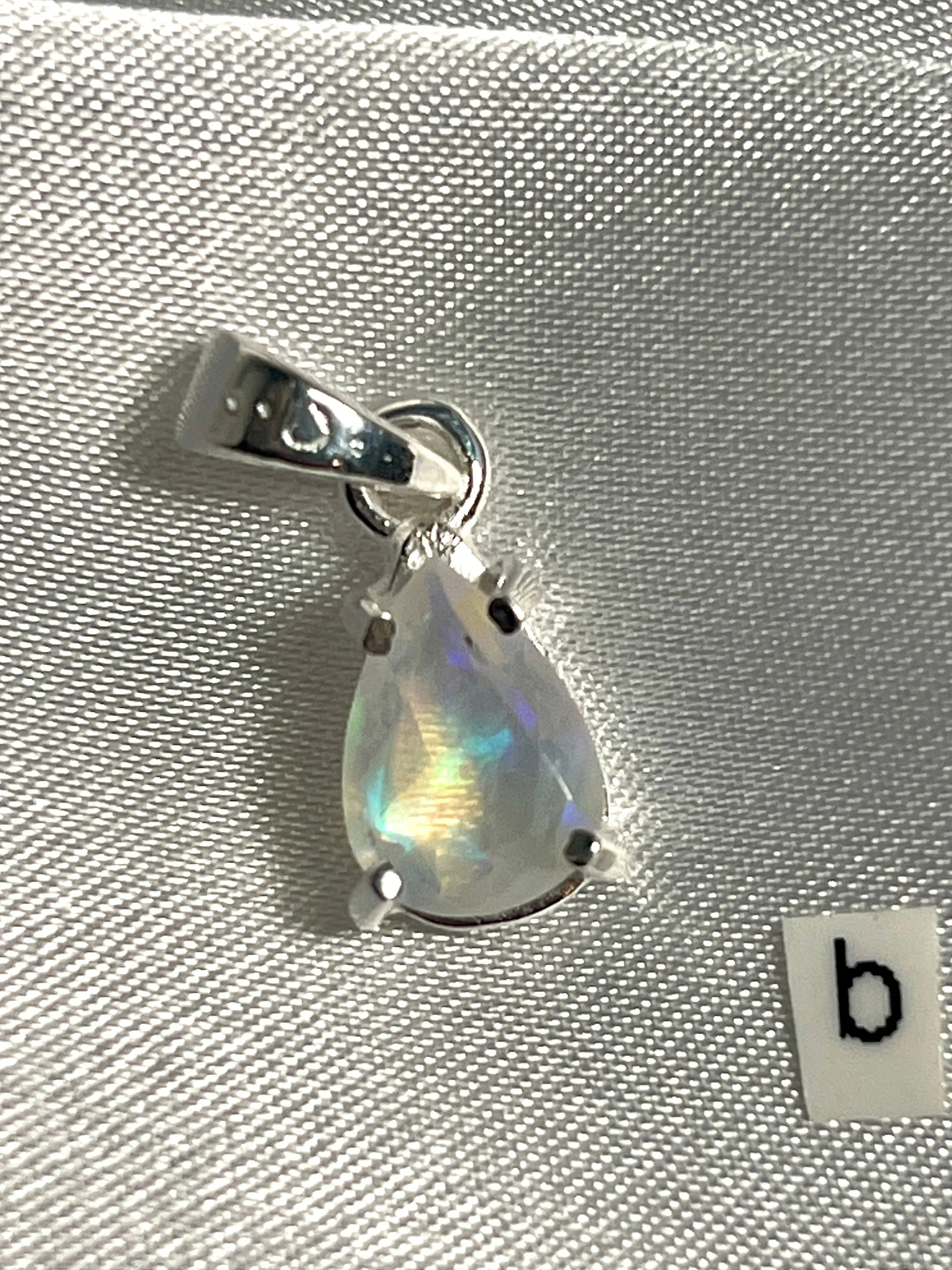 Dainty Prong Set Facet Cut Teardrop Shaped Ethiopian Opal Pendant