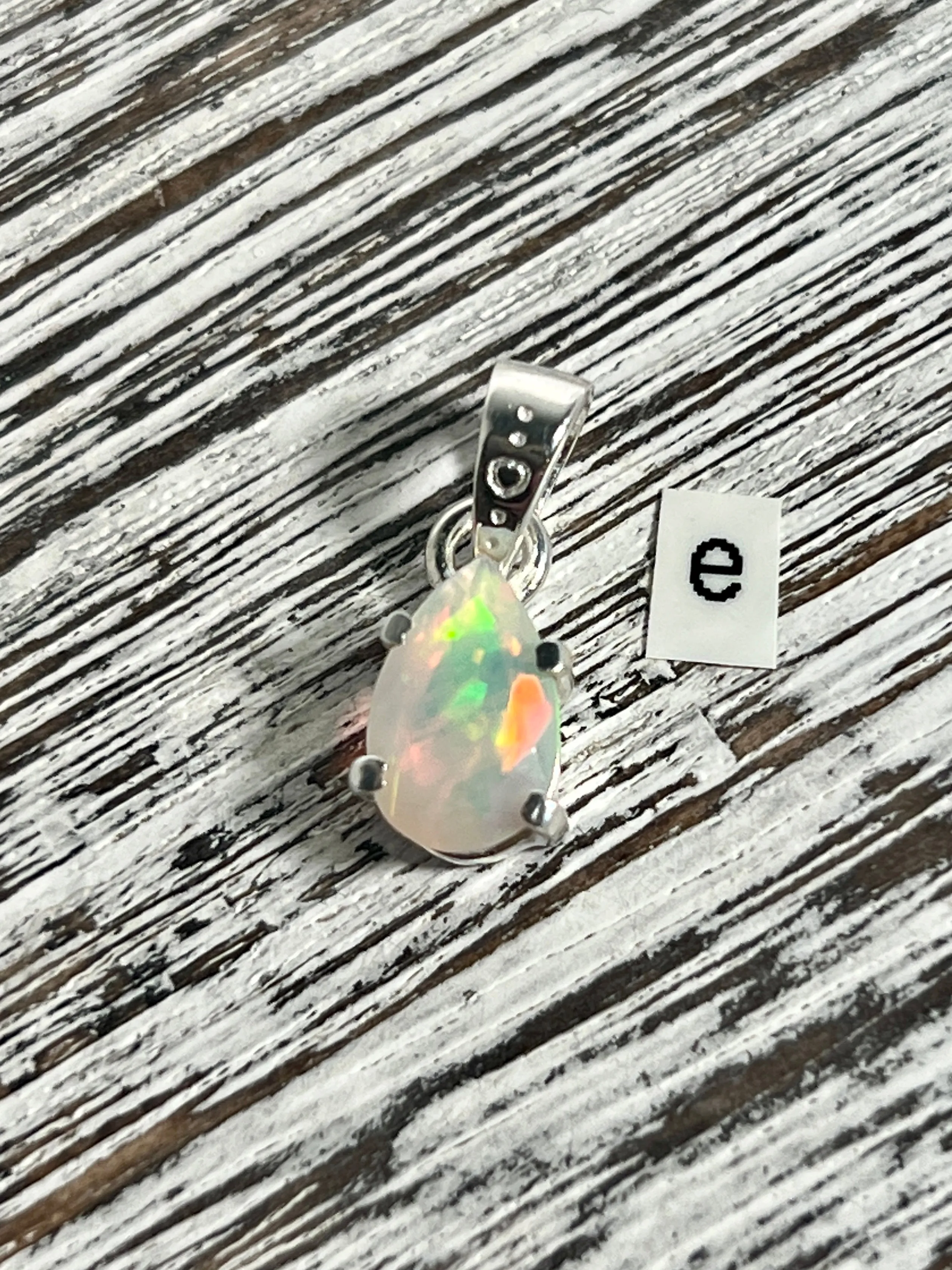 Dainty Prong Set Facet Cut Teardrop Shaped Ethiopian Opal Pendant