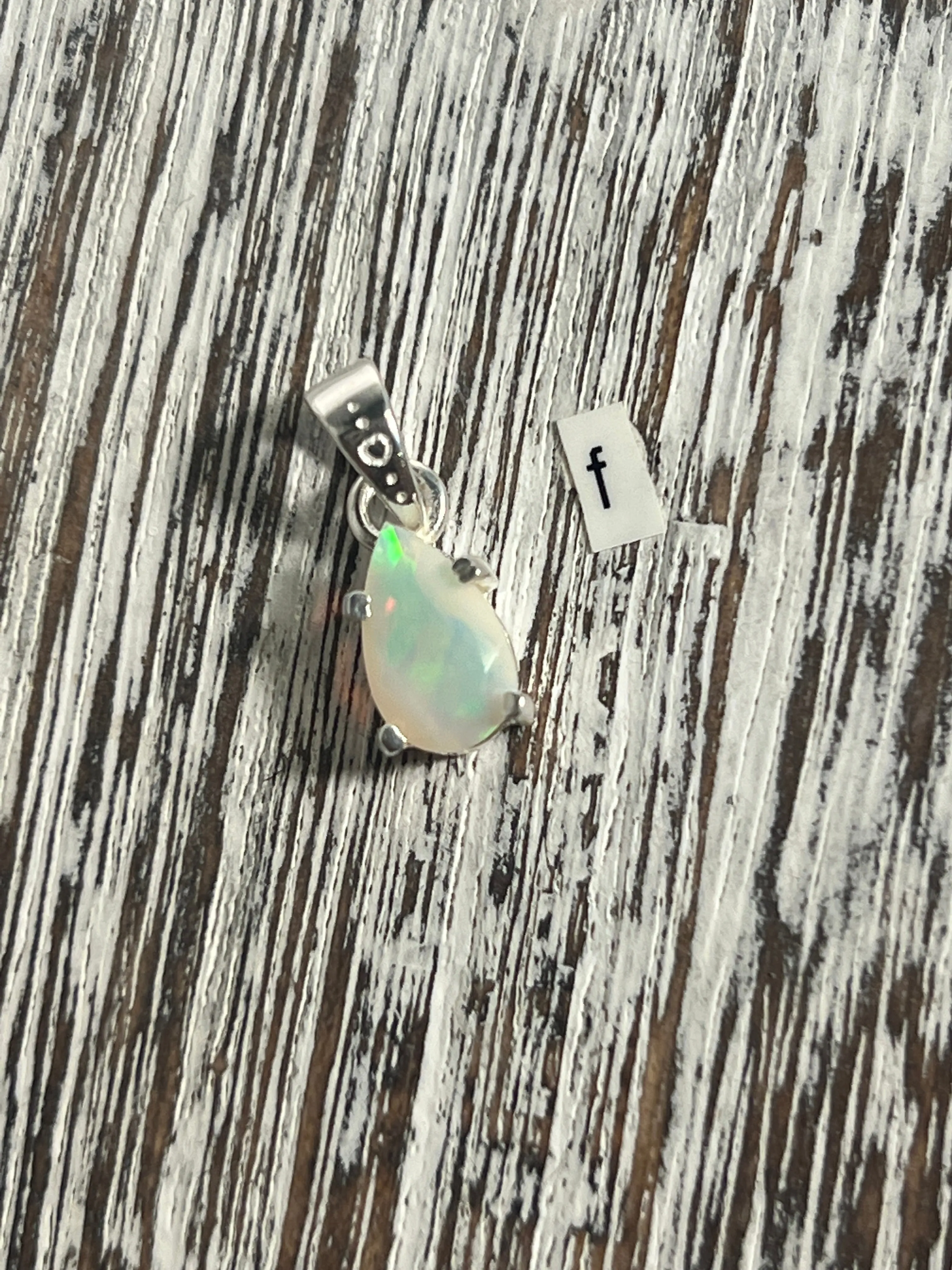 Dainty Prong Set Facet Cut Teardrop Shaped Ethiopian Opal Pendant