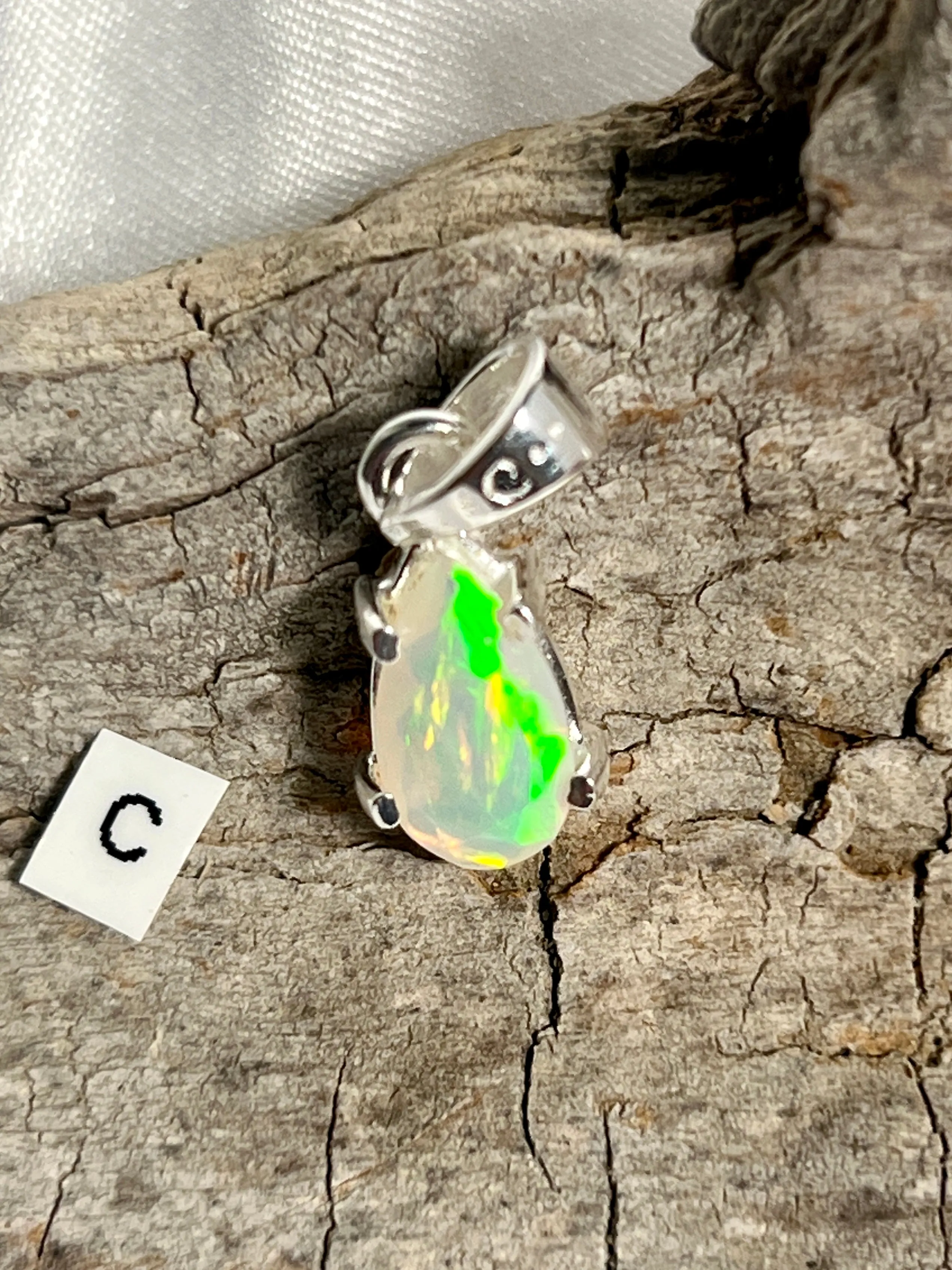 Dainty Prong Set Facet Cut Teardrop Shaped Ethiopian Opal Pendant
