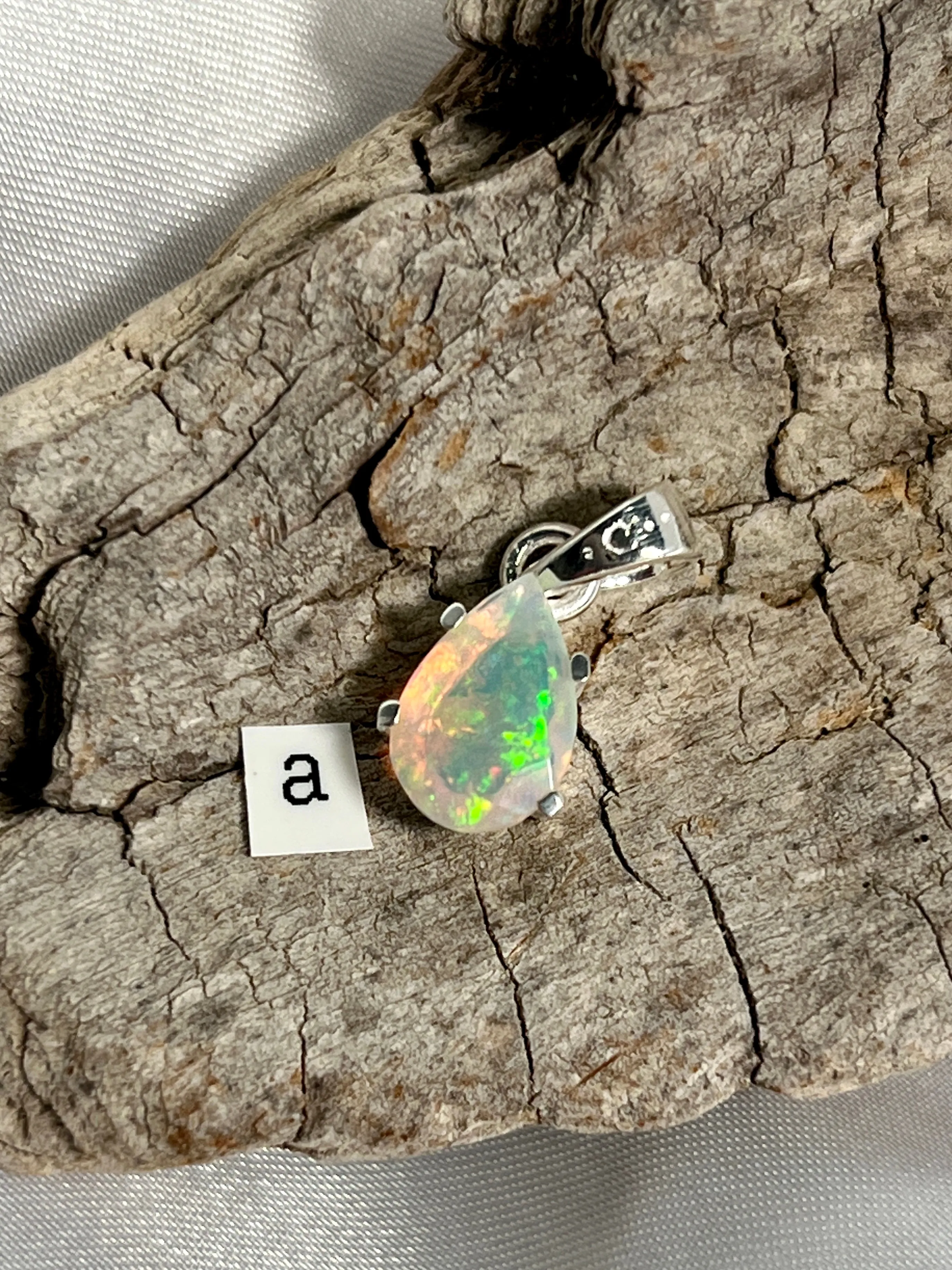 Dainty Prong Set Facet Cut Teardrop Shaped Ethiopian Opal Pendant