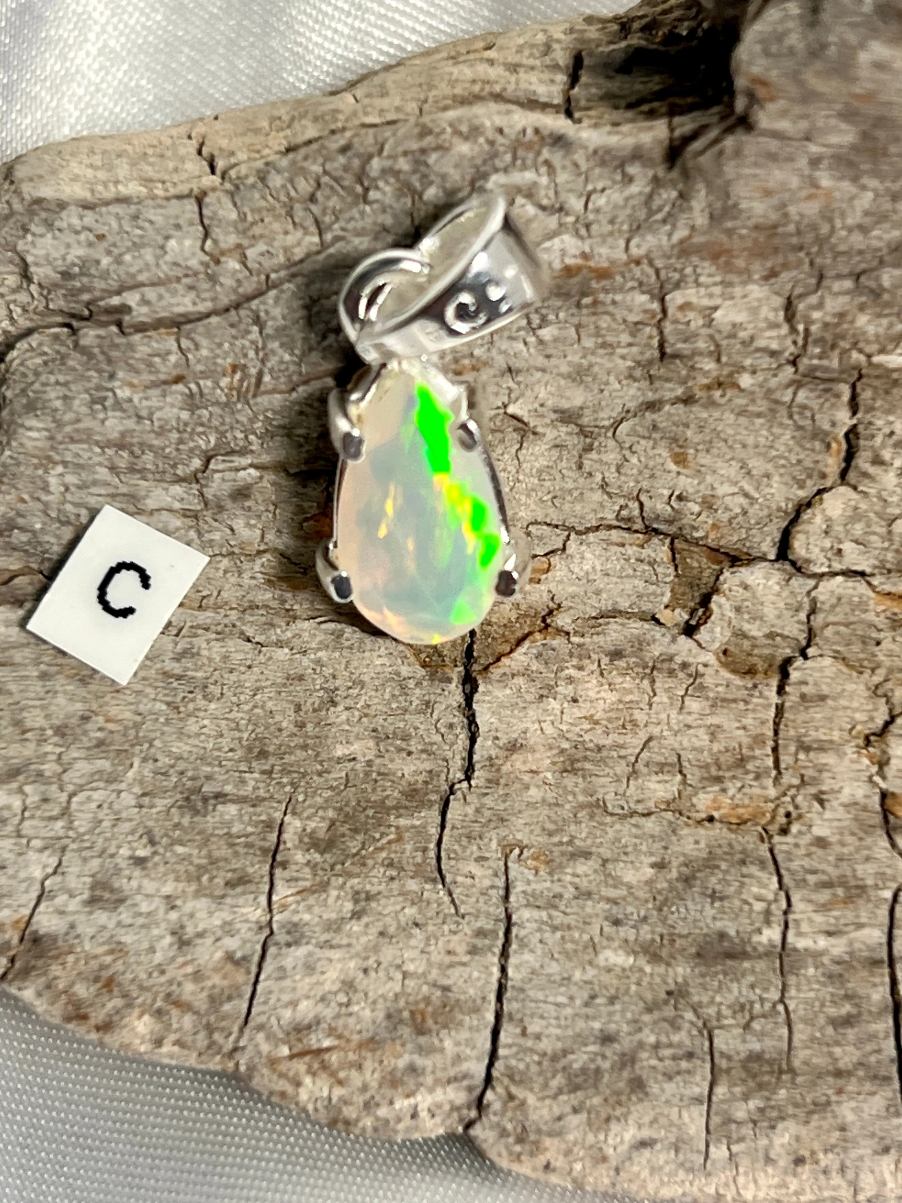 Dainty Prong Set Facet Cut Teardrop Shaped Ethiopian Opal Pendant