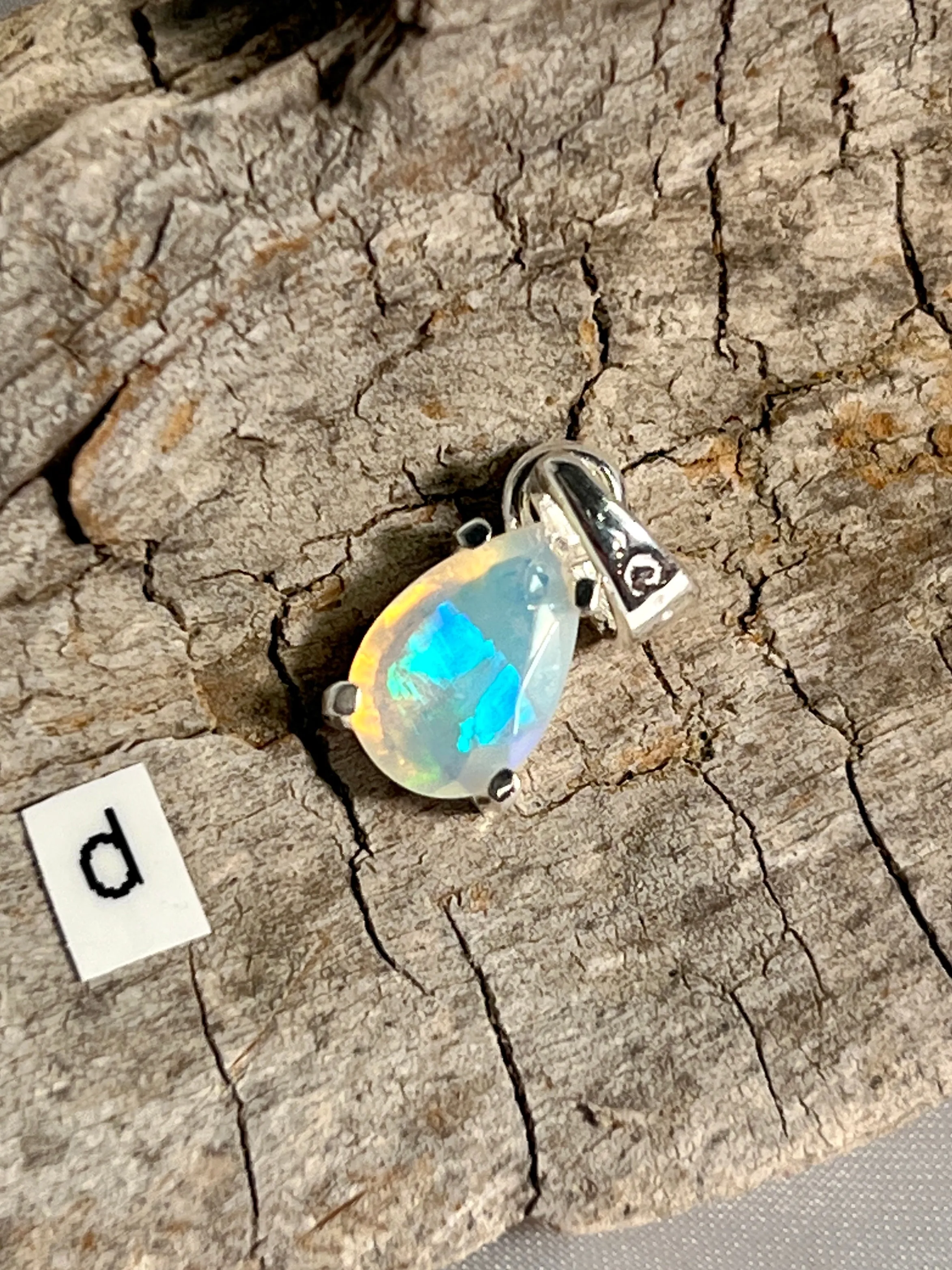 Dainty Prong Set Facet Cut Teardrop Shaped Ethiopian Opal Pendant