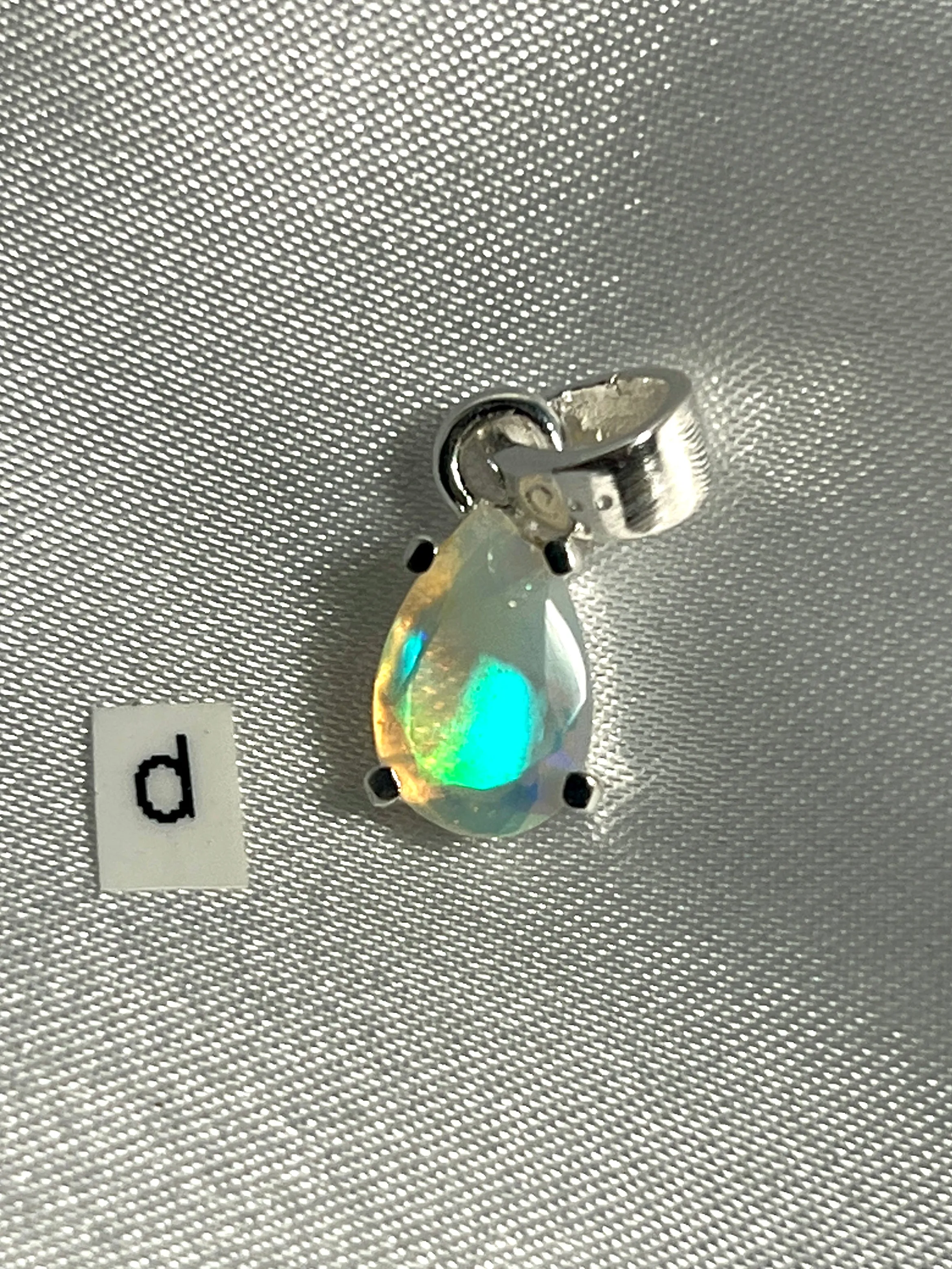 Dainty Prong Set Facet Cut Teardrop Shaped Ethiopian Opal Pendant