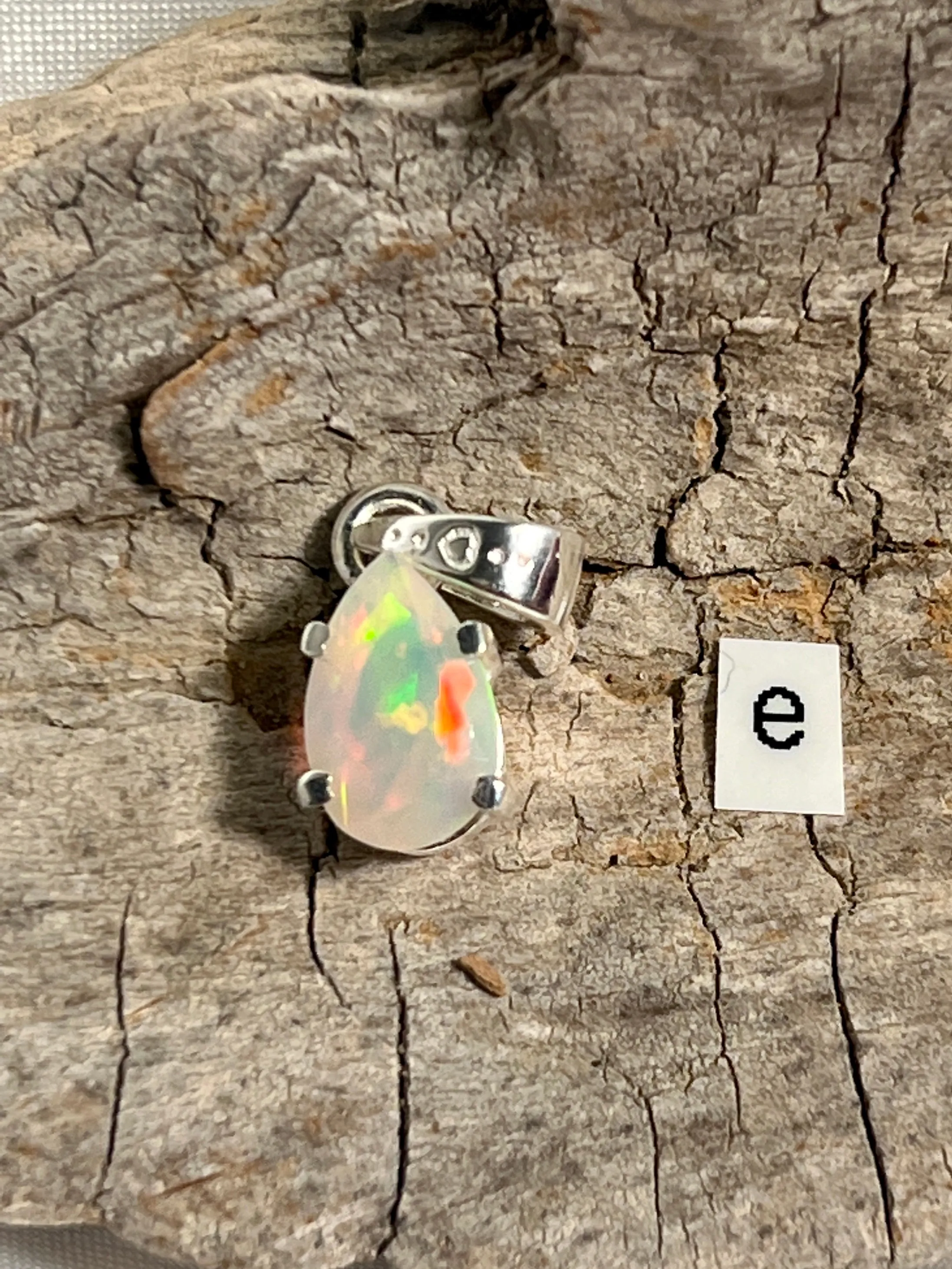 Dainty Prong Set Facet Cut Teardrop Shaped Ethiopian Opal Pendant