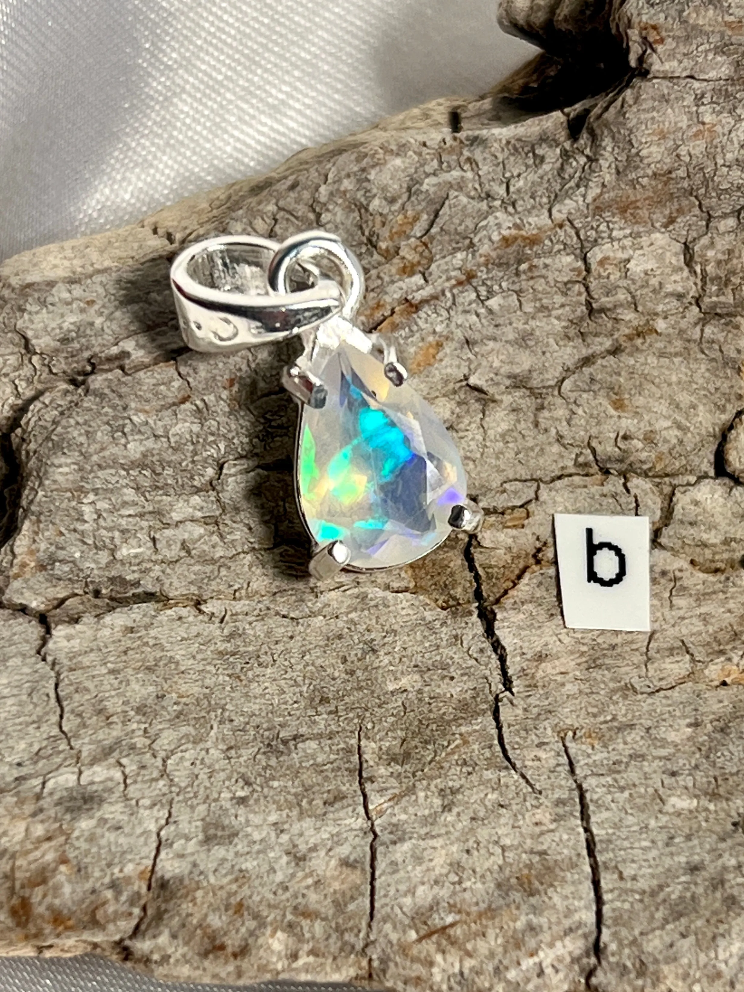 Dainty Prong Set Facet Cut Teardrop Shaped Ethiopian Opal Pendant