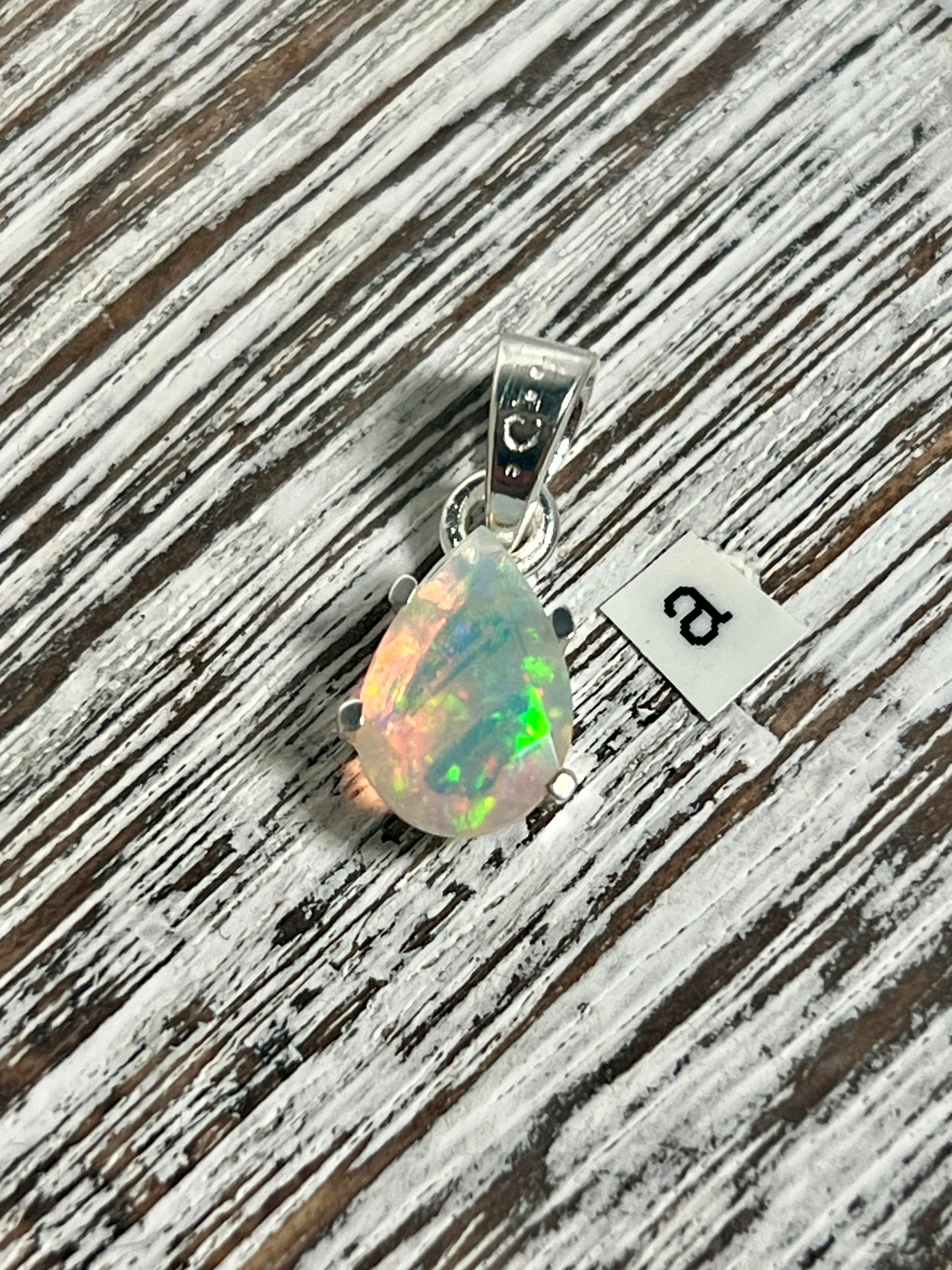 Dainty Prong Set Facet Cut Teardrop Shaped Ethiopian Opal Pendant