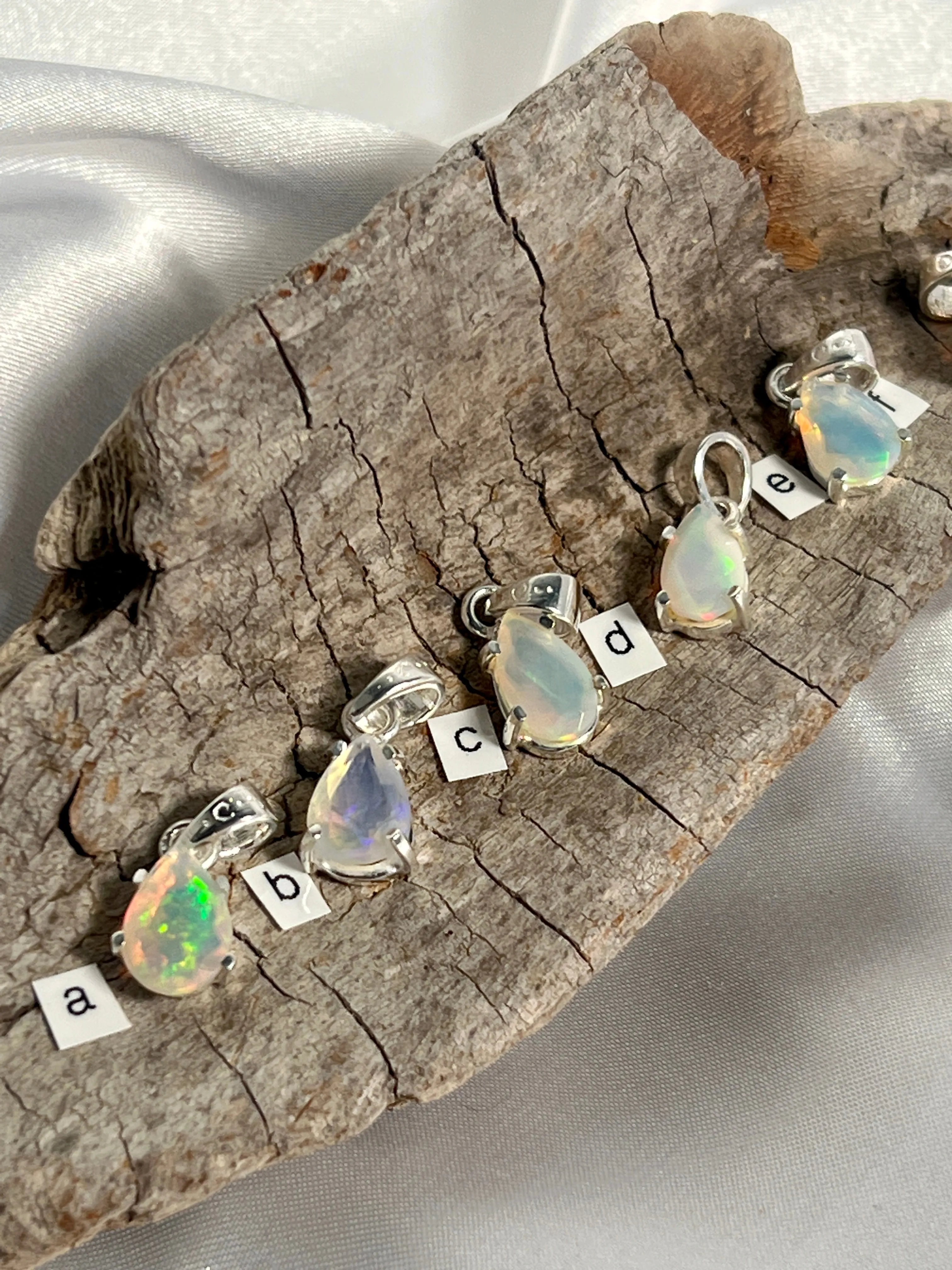 Dainty Prong Set Facet Cut Teardrop Shaped Ethiopian Opal Pendant