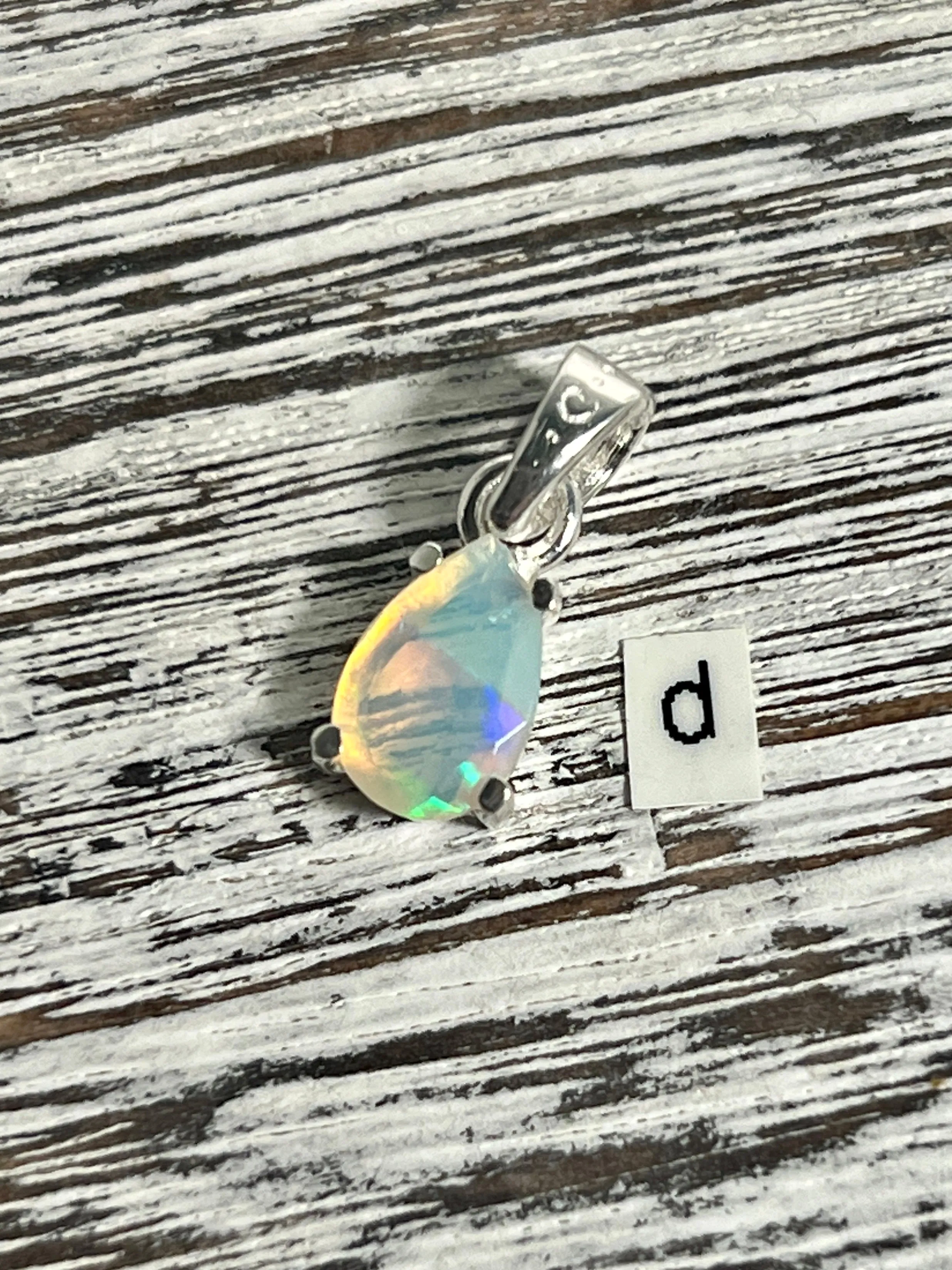 Dainty Prong Set Facet Cut Teardrop Shaped Ethiopian Opal Pendant