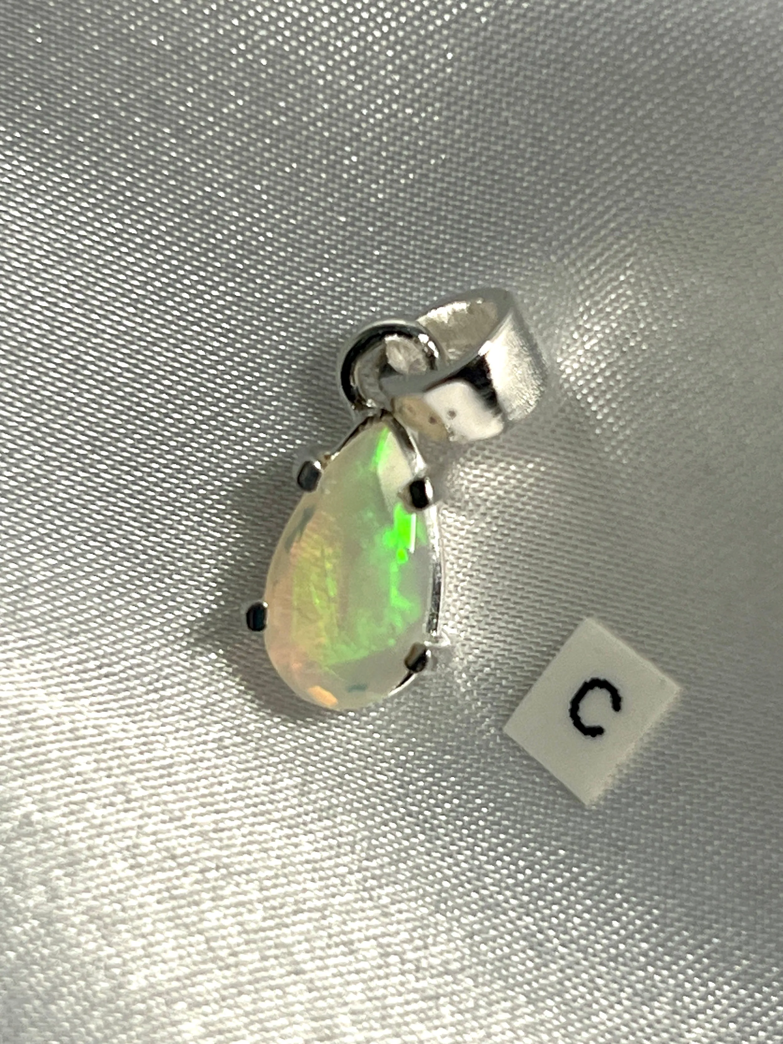 Dainty Prong Set Facet Cut Teardrop Shaped Ethiopian Opal Pendant