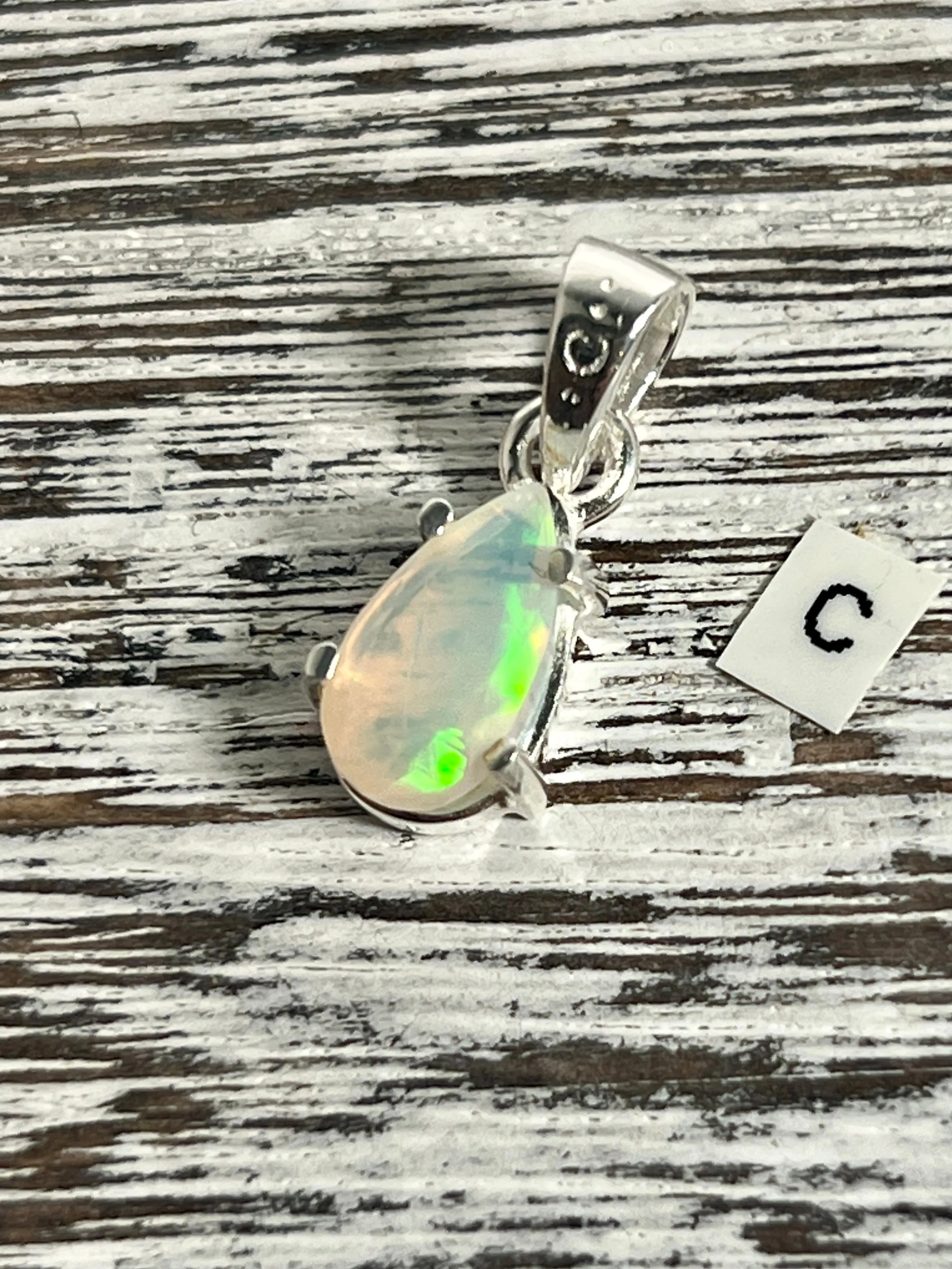 Dainty Prong Set Facet Cut Teardrop Shaped Ethiopian Opal Pendant