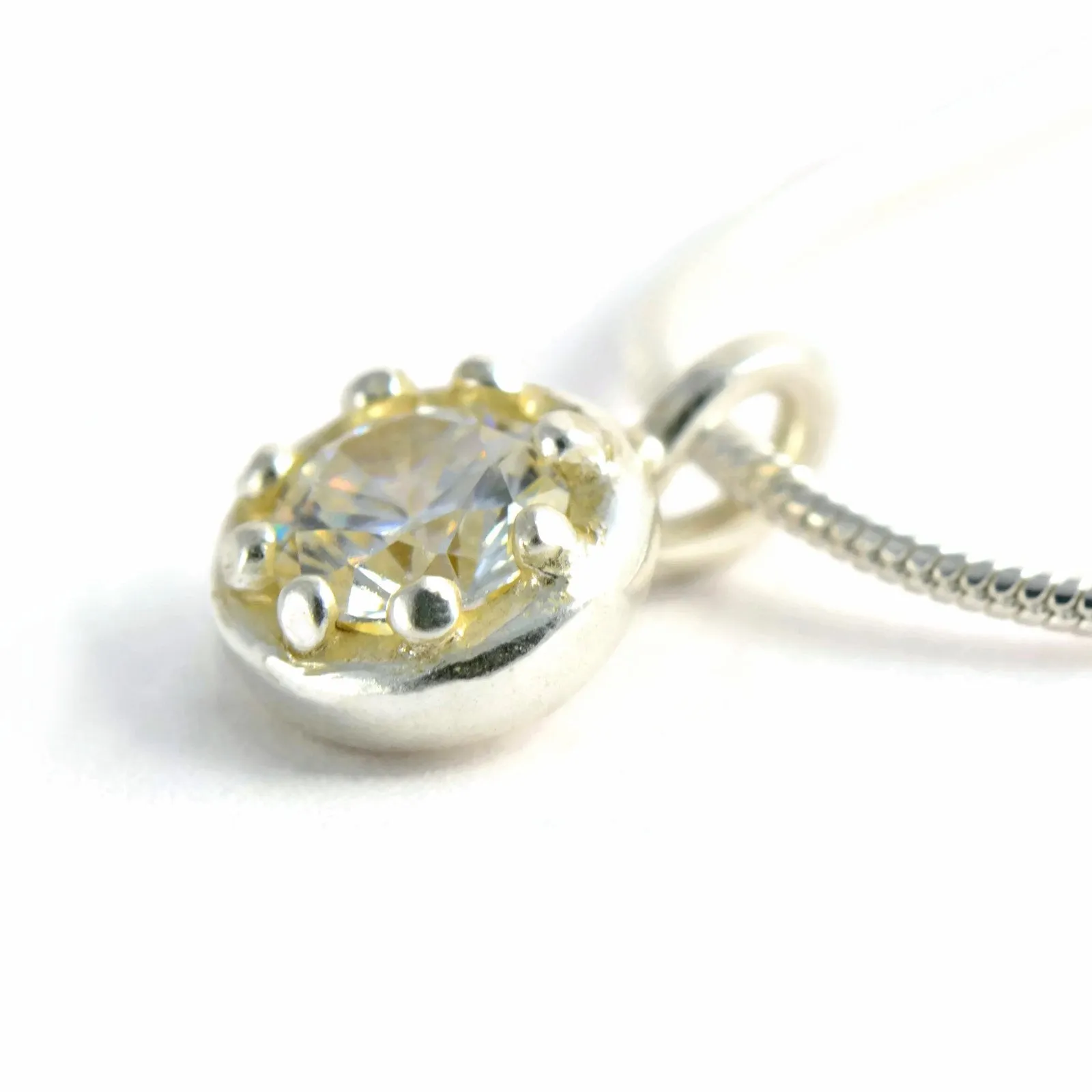 Delicate silver pendant with an elegant crown basket frame and gemstone of your choice