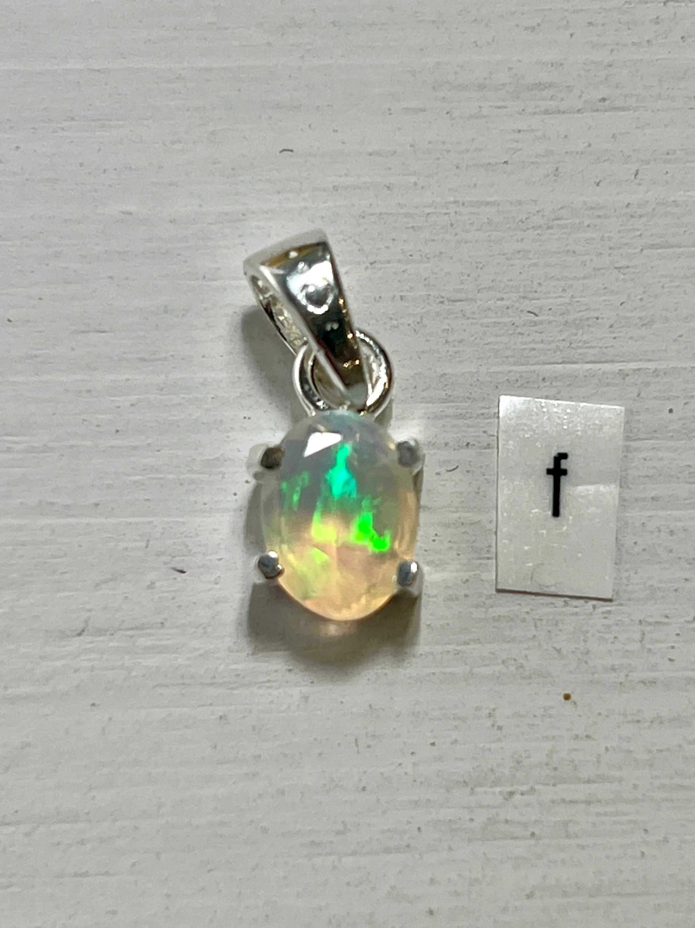 Tiny Facet Cut Prong Set Ethiopian Opal Pendant