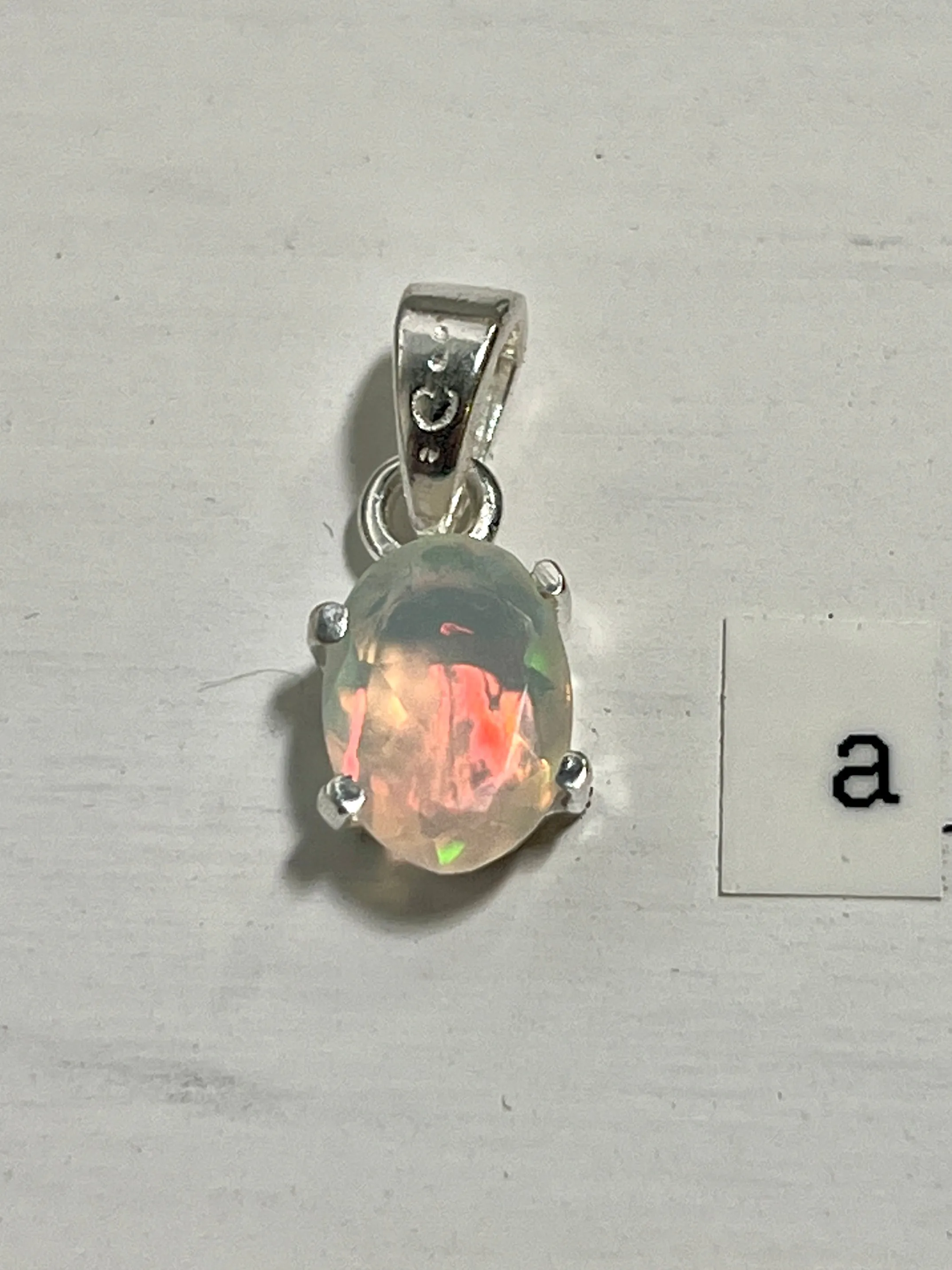 Tiny Facet Cut Prong Set Ethiopian Opal Pendant