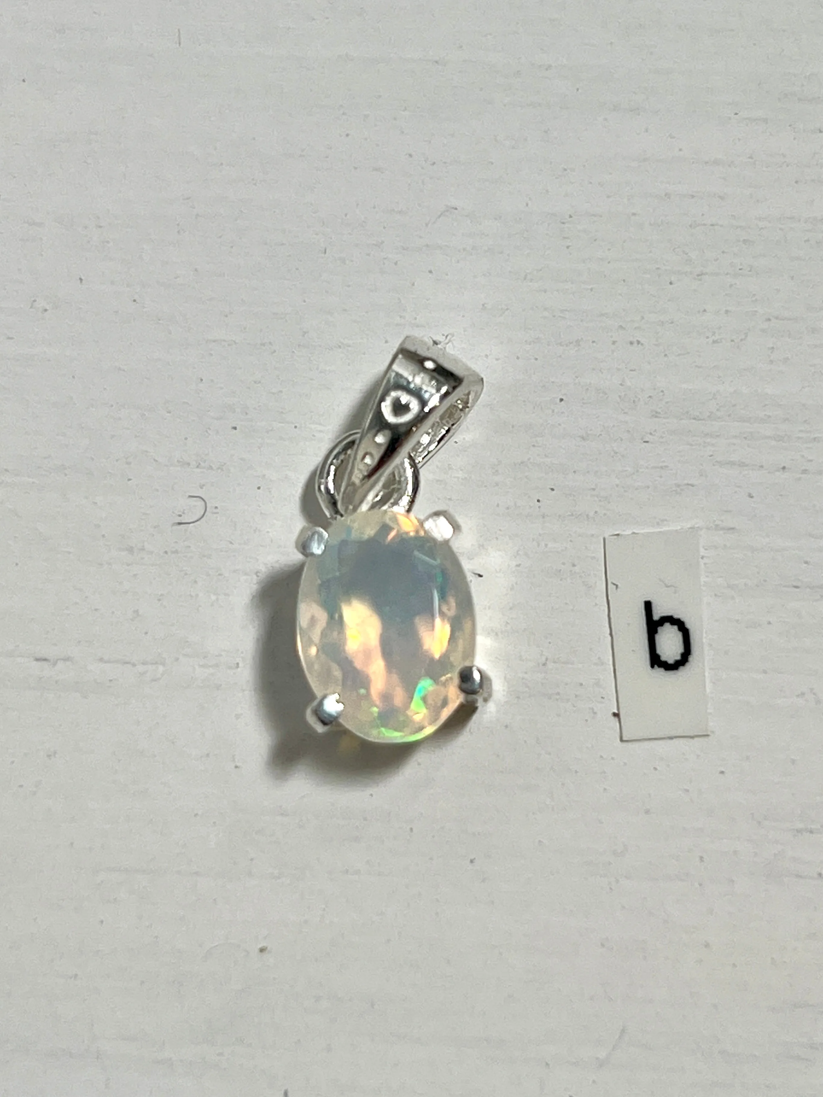 Tiny Facet Cut Prong Set Ethiopian Opal Pendant