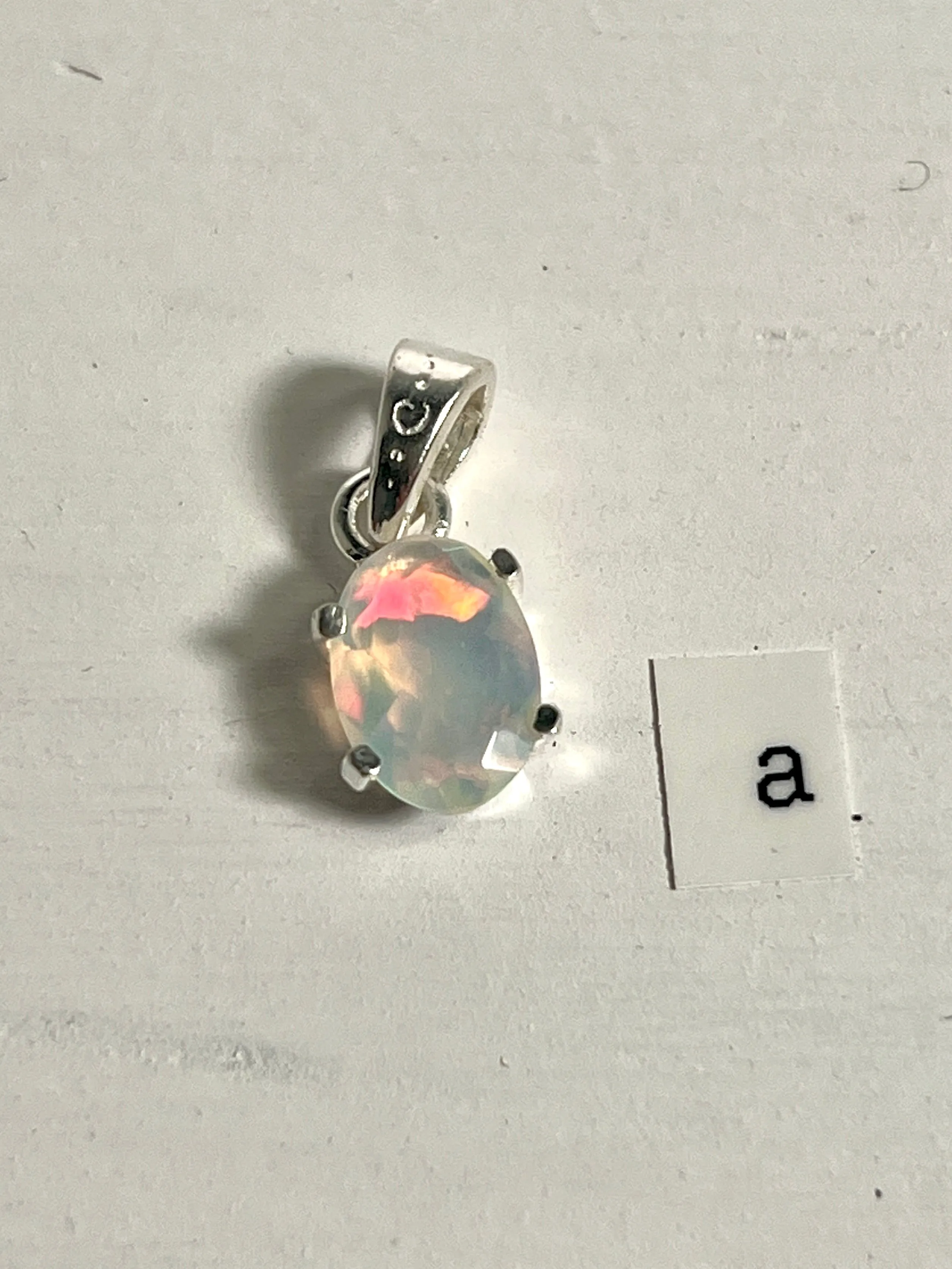 Tiny Facet Cut Prong Set Ethiopian Opal Pendant