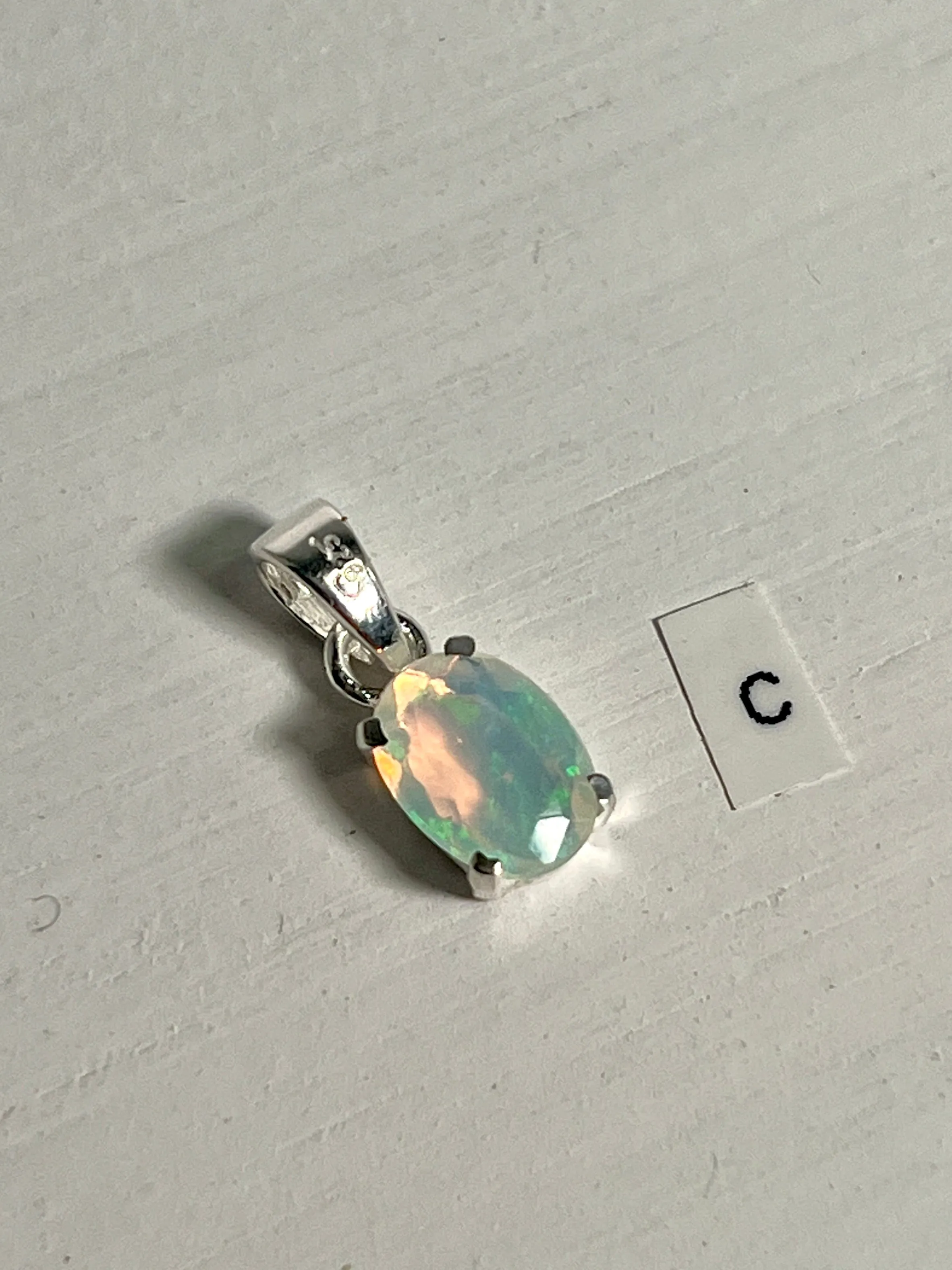 Tiny Facet Cut Prong Set Ethiopian Opal Pendant