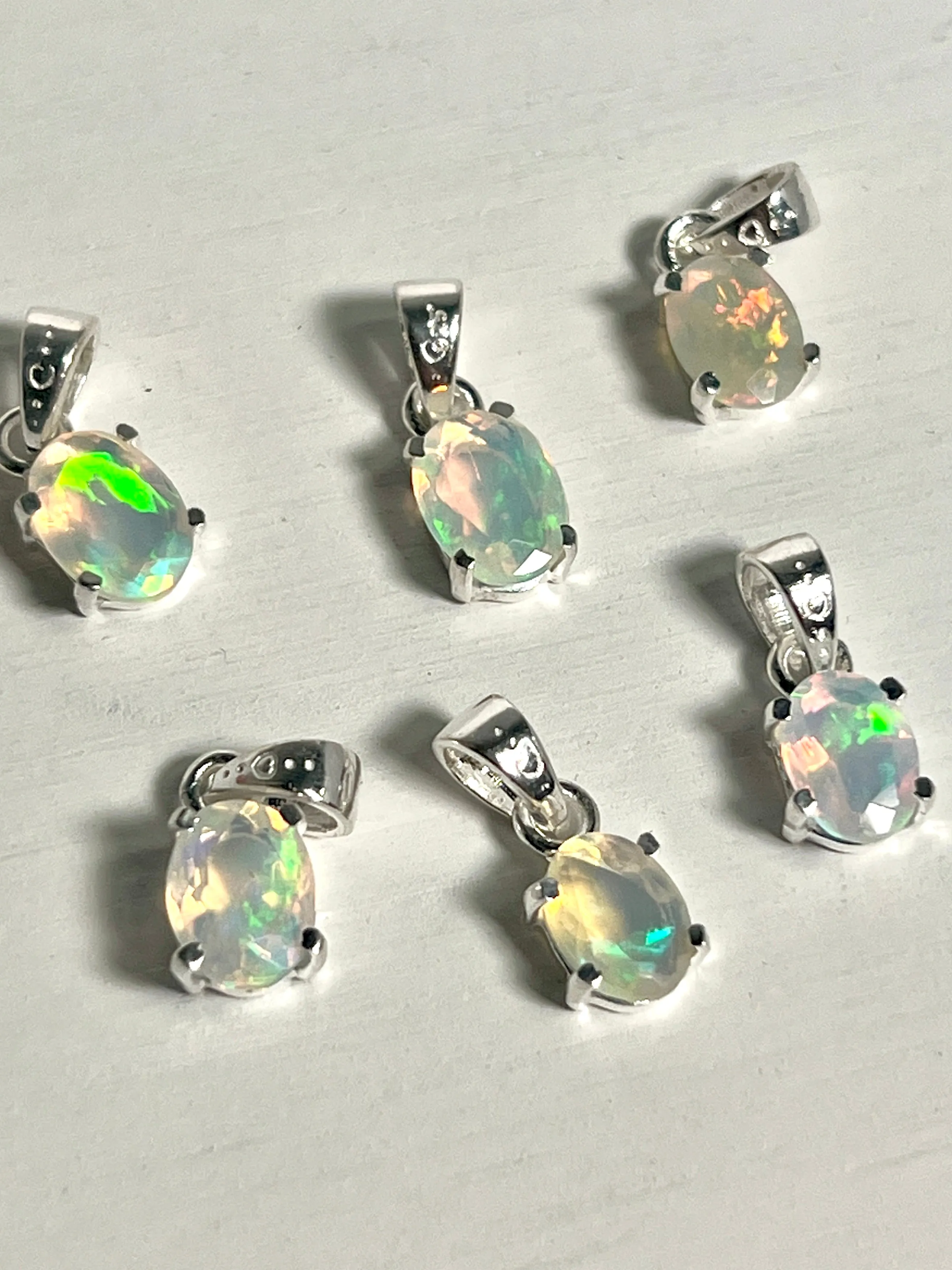 Tiny Facet Cut Prong Set Ethiopian Opal Pendant