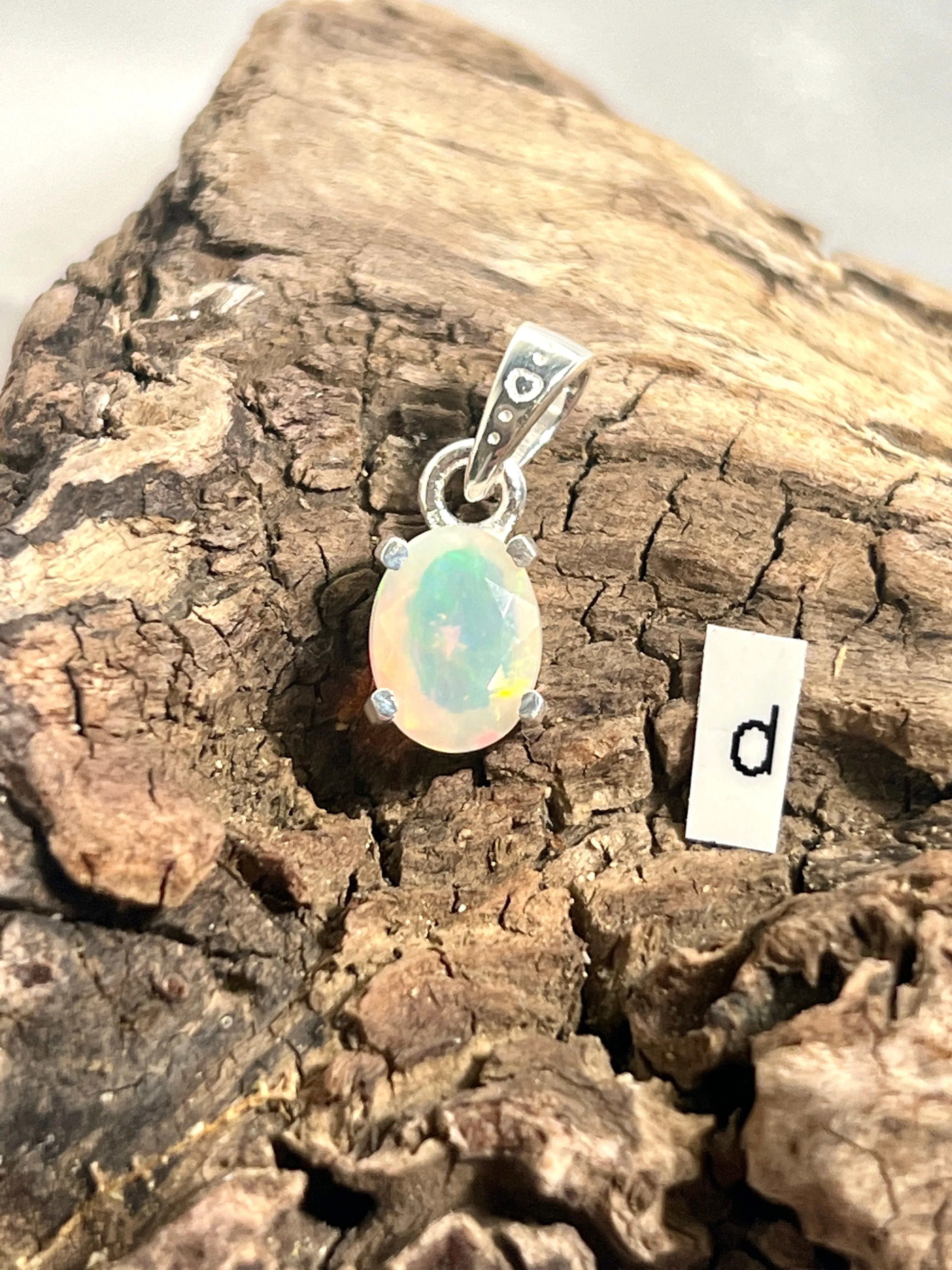 Tiny Facet Cut Prong Set Ethiopian Opal Pendant