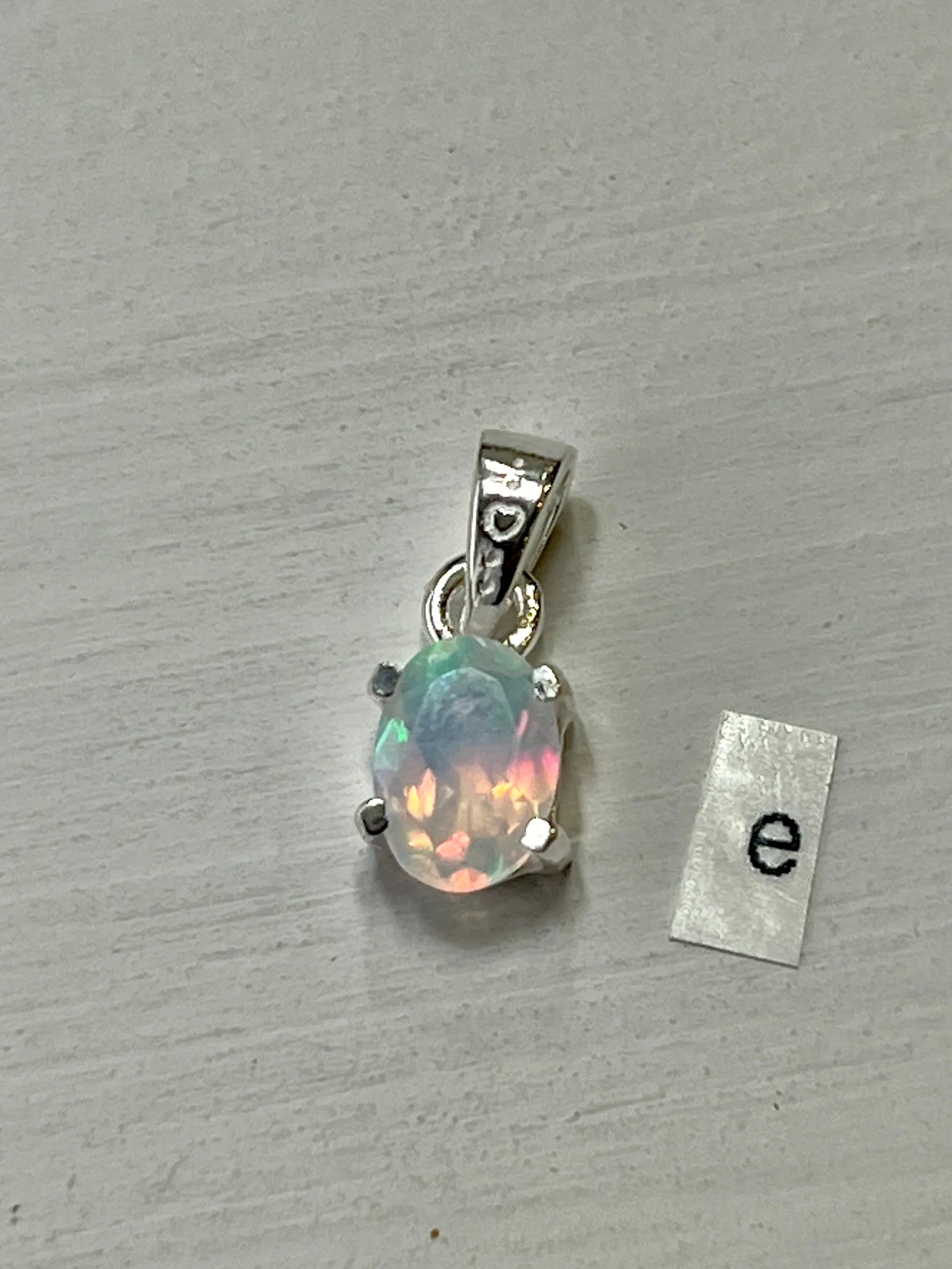 Tiny Facet Cut Prong Set Ethiopian Opal Pendant