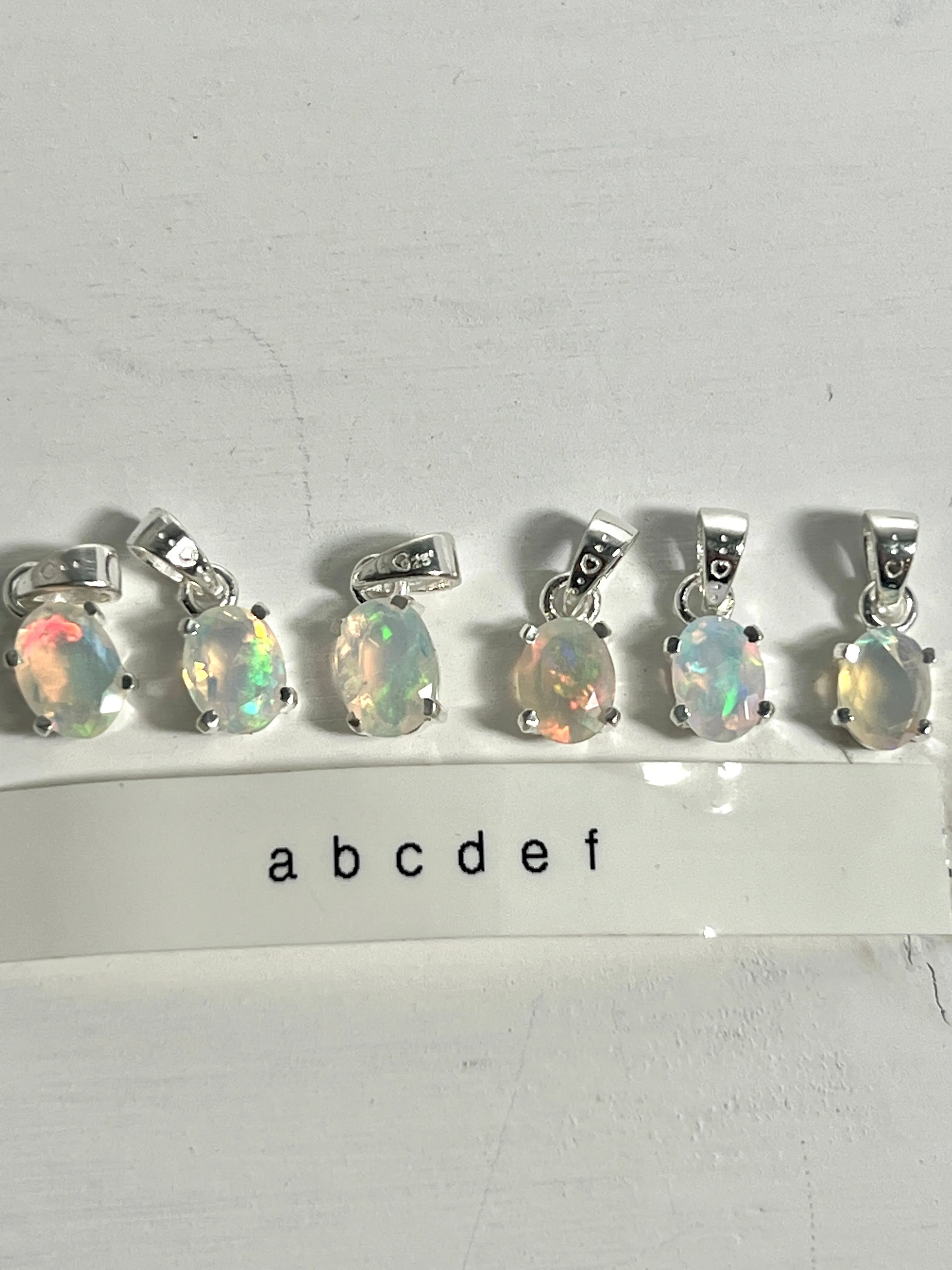 Tiny Facet Cut Prong Set Ethiopian Opal Pendant