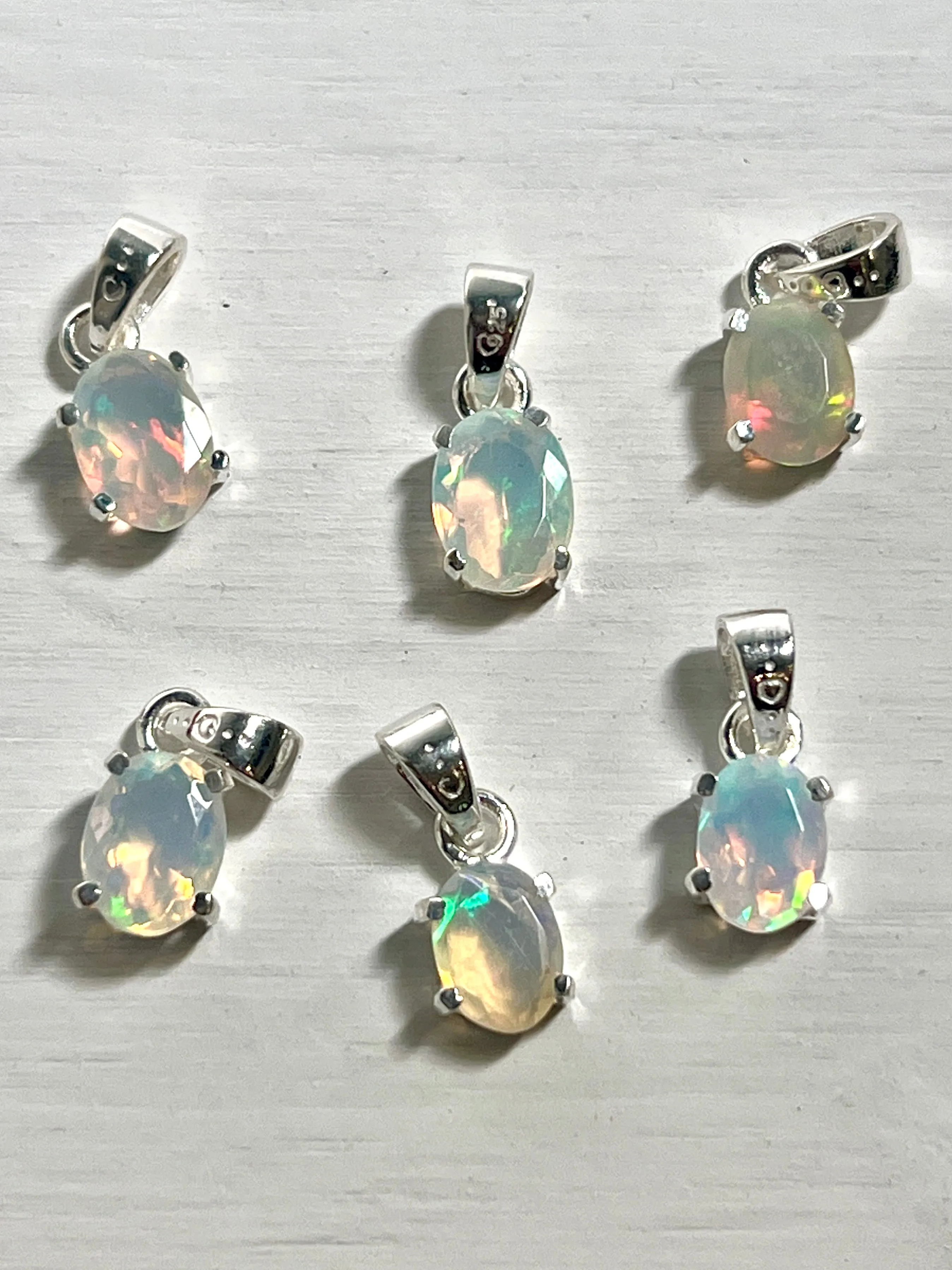 Tiny Facet Cut Prong Set Ethiopian Opal Pendant