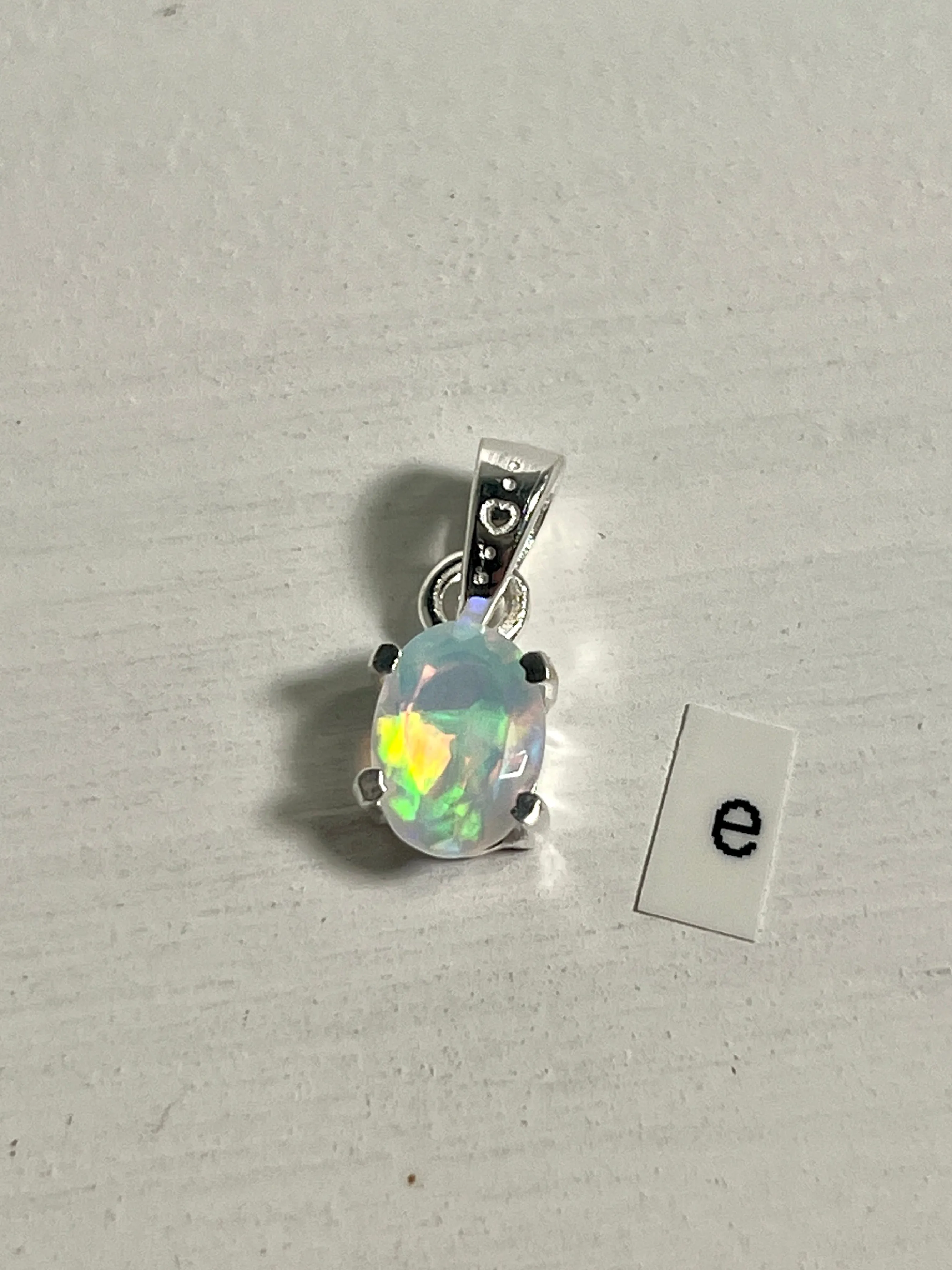 Tiny Facet Cut Prong Set Ethiopian Opal Pendant