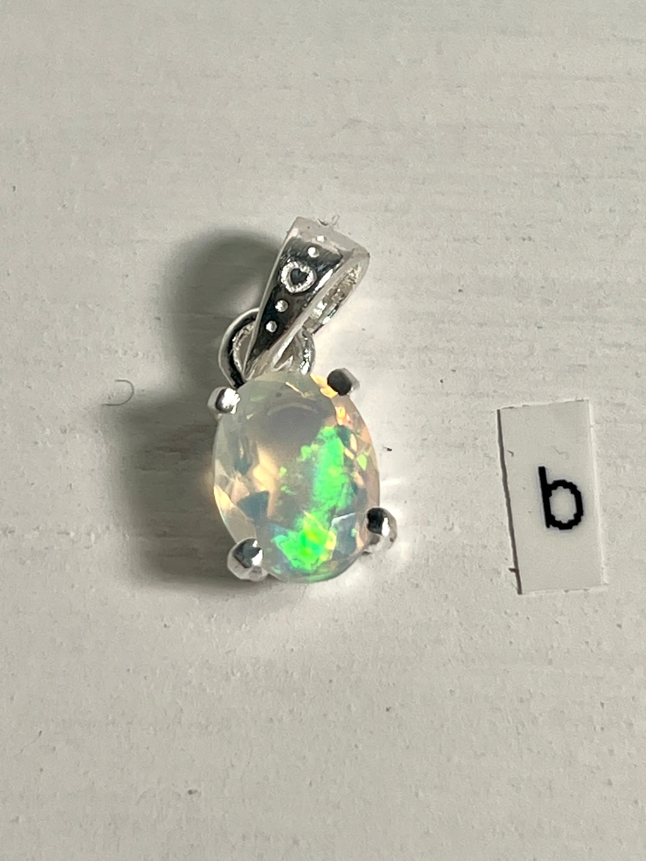 Tiny Facet Cut Prong Set Ethiopian Opal Pendant