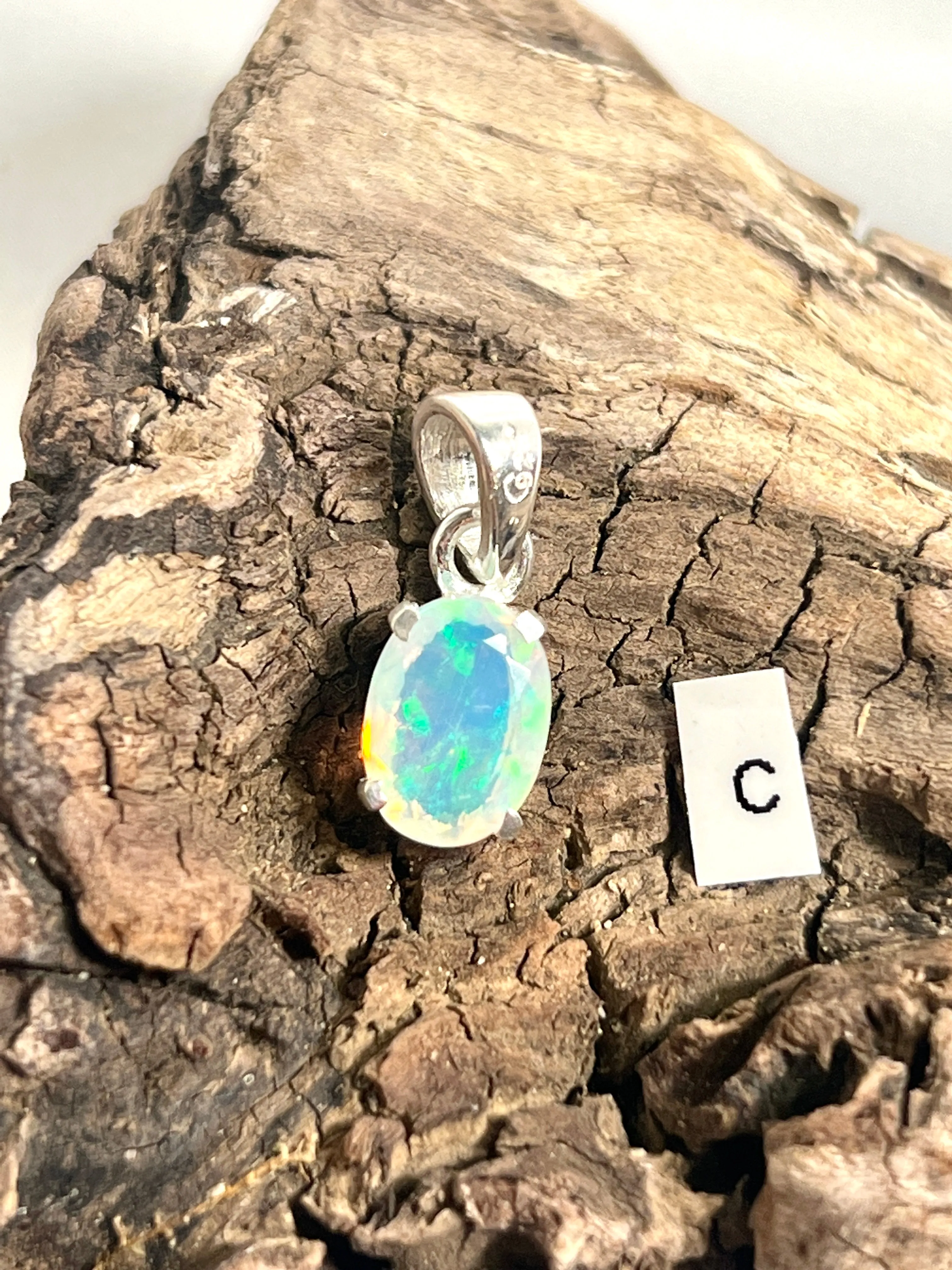 Tiny Facet Cut Prong Set Ethiopian Opal Pendant