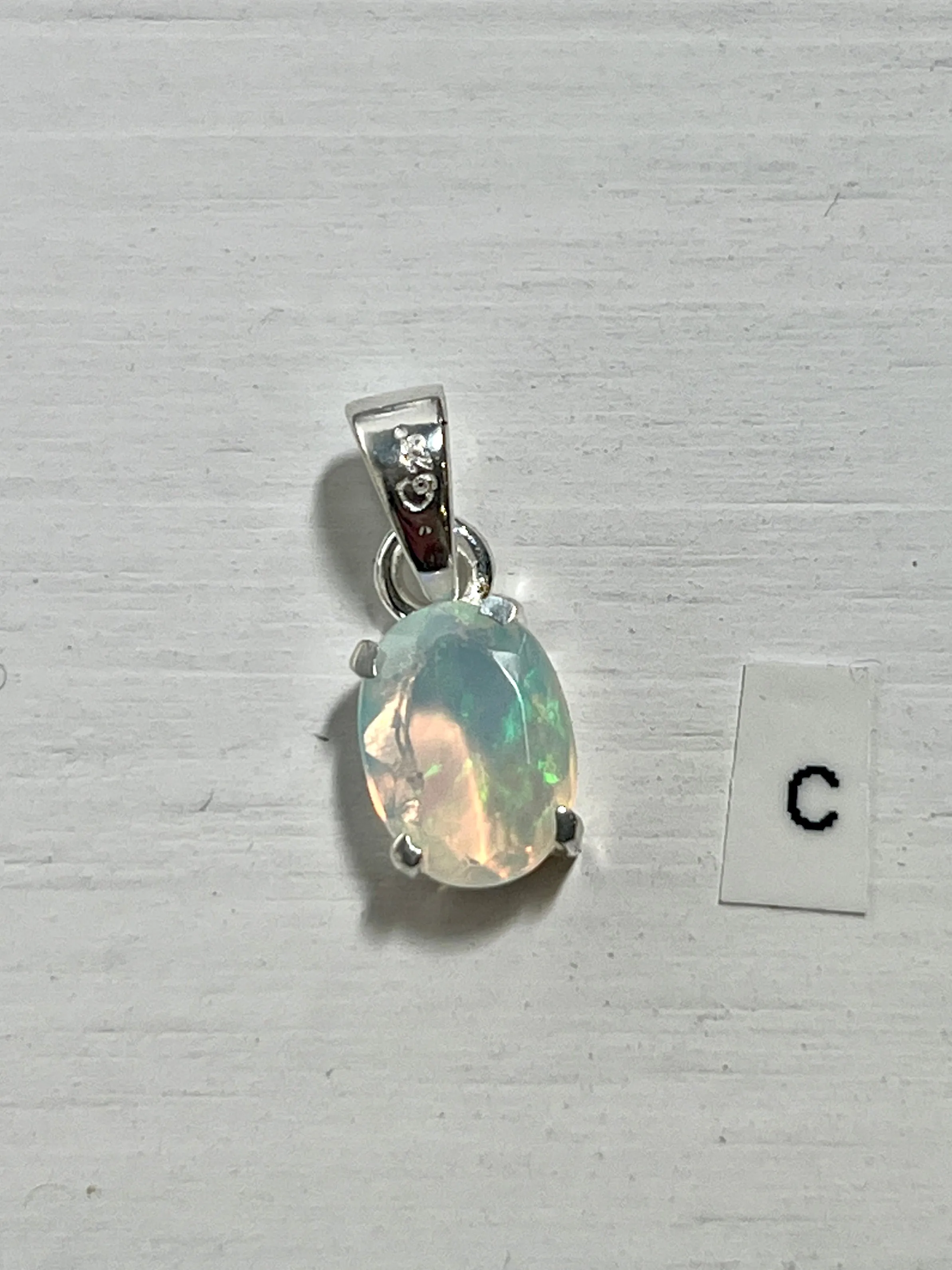 Tiny Facet Cut Prong Set Ethiopian Opal Pendant