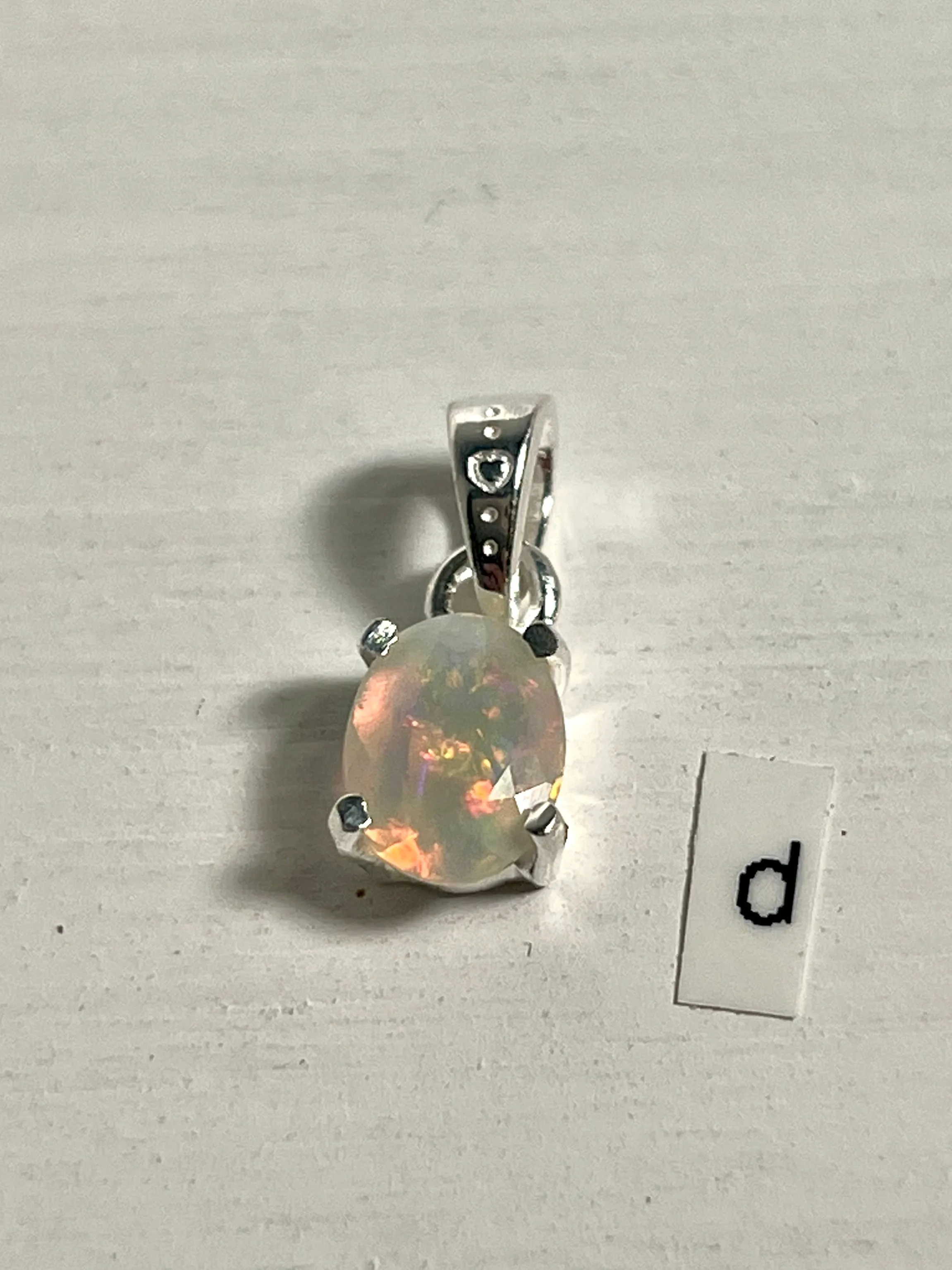 Tiny Facet Cut Prong Set Ethiopian Opal Pendant