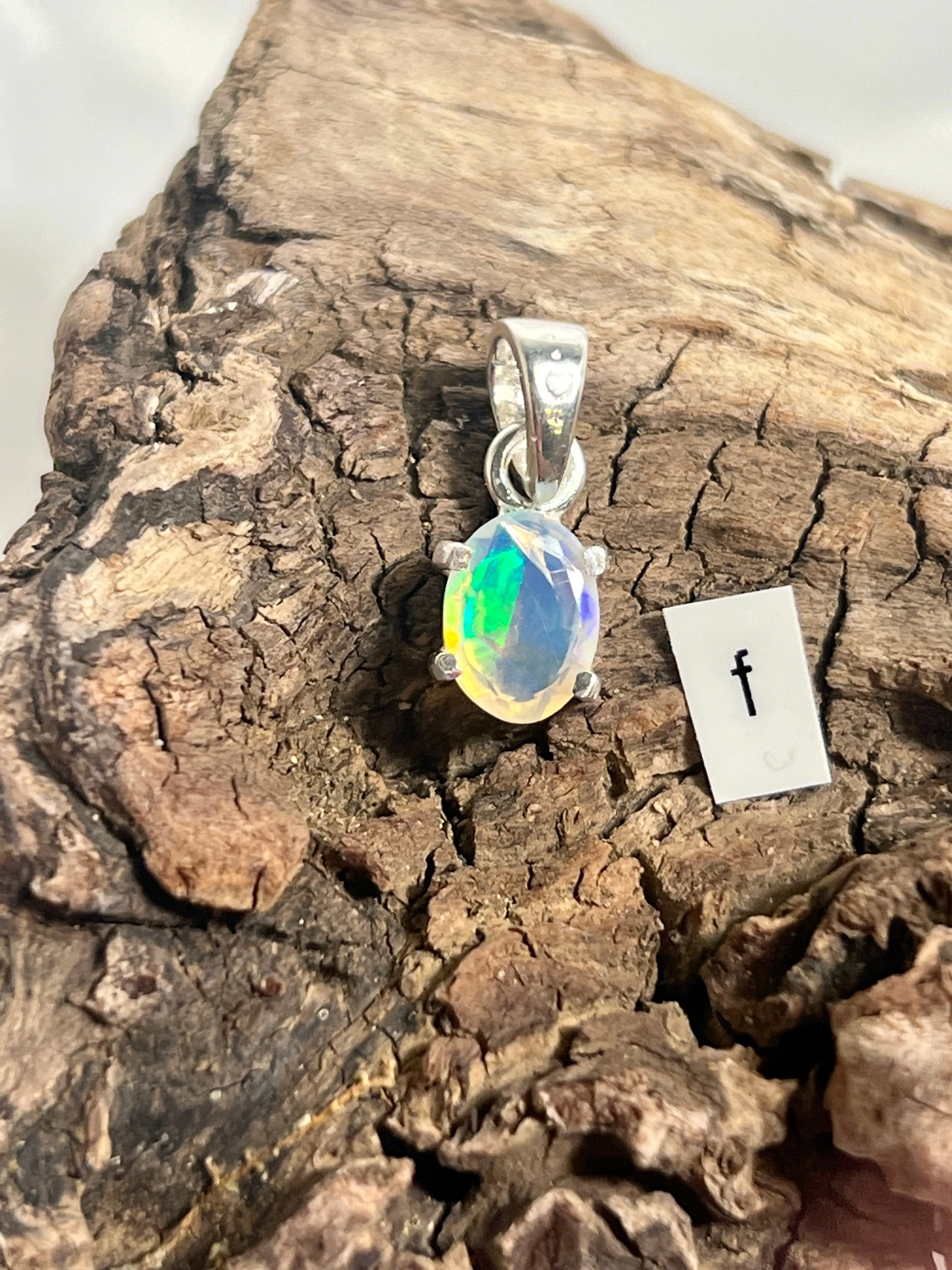 Tiny Facet Cut Prong Set Ethiopian Opal Pendant